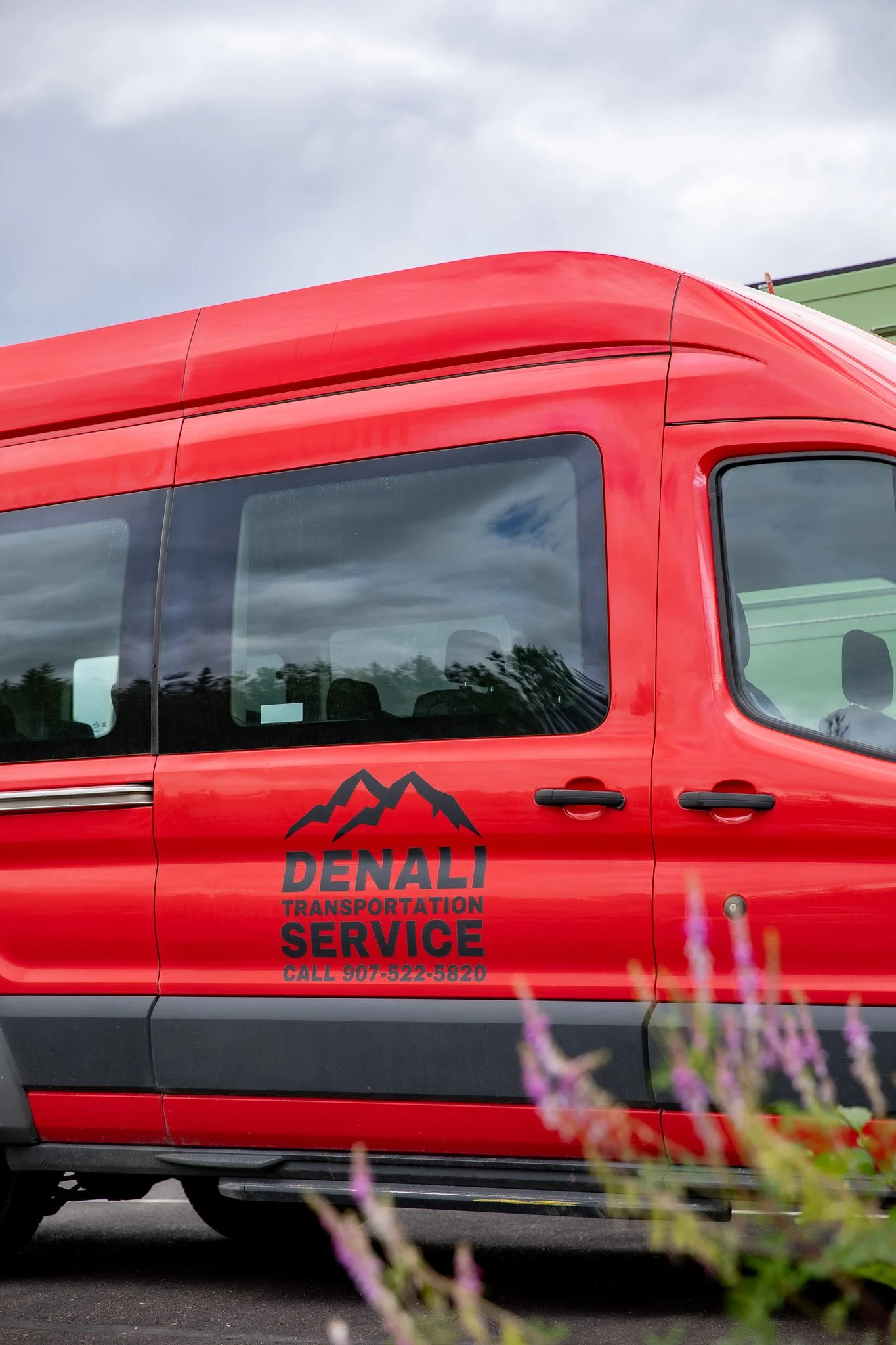 Denali Transportation Service shuttle van providing hotel pickup near Denali National Park entrance