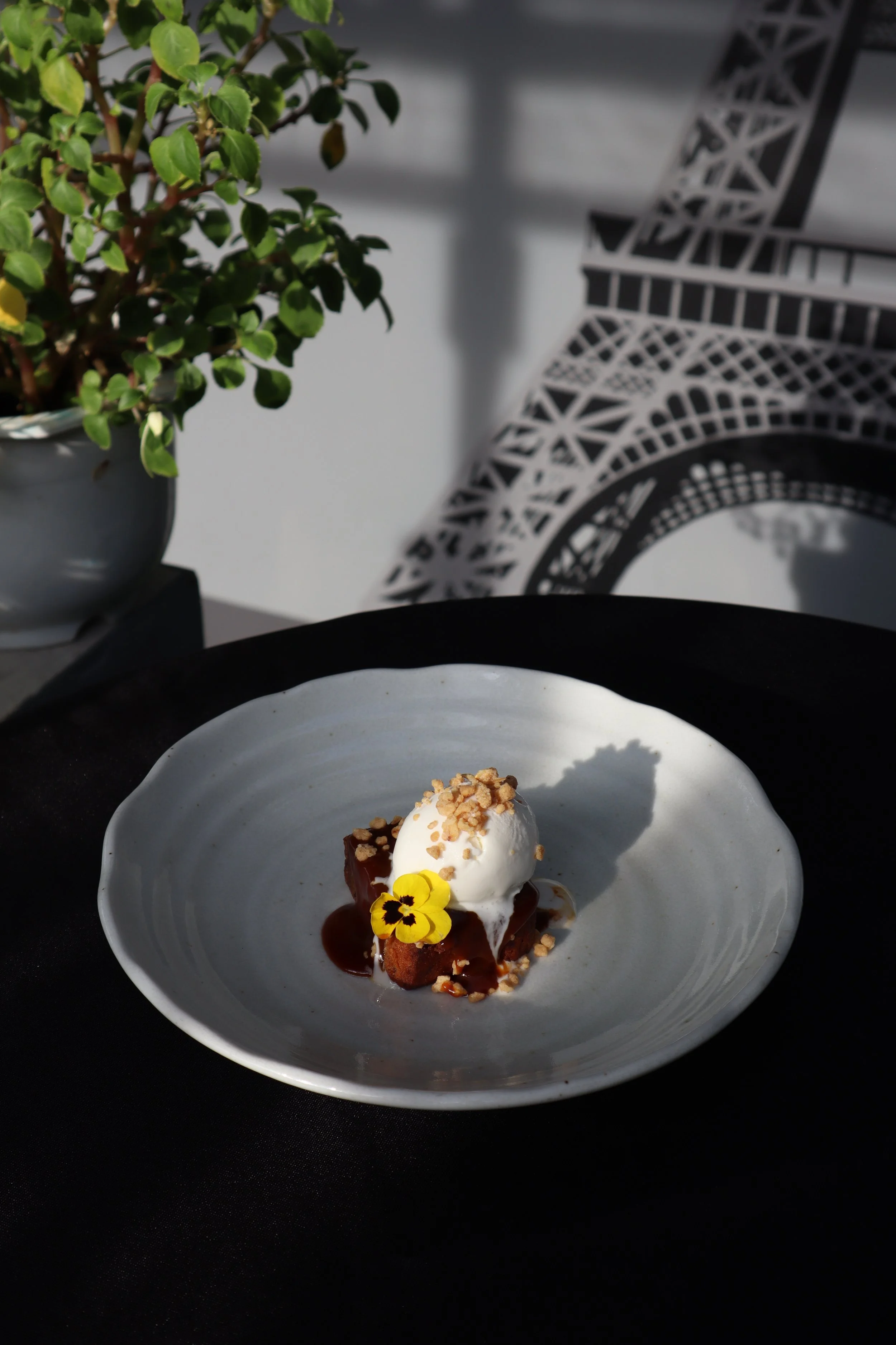 Warm and delicious banana cake with salted caramel butter and high quality coconut ice cream, one of the desserts served at Le Rendez-Vous, gourmet French restaurant in Da Nang, Vietnam