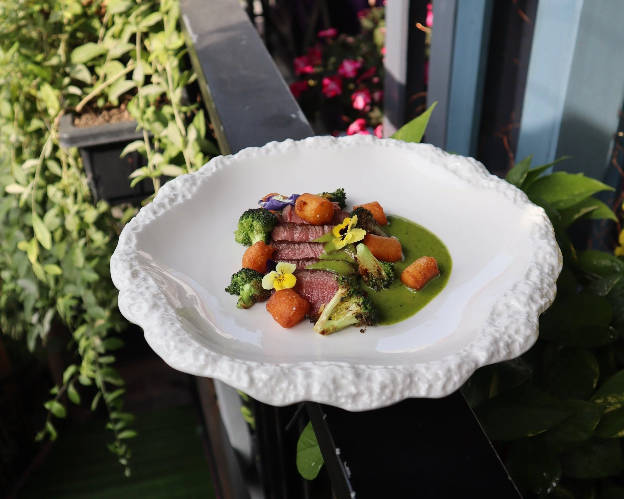 Perfectly cooked Australian beef tenderloin with Café de Paris sauce, one of the delicious dishes served at Le Rendez-Vous, gourmet French restaurant in Da Nang, Vietnam