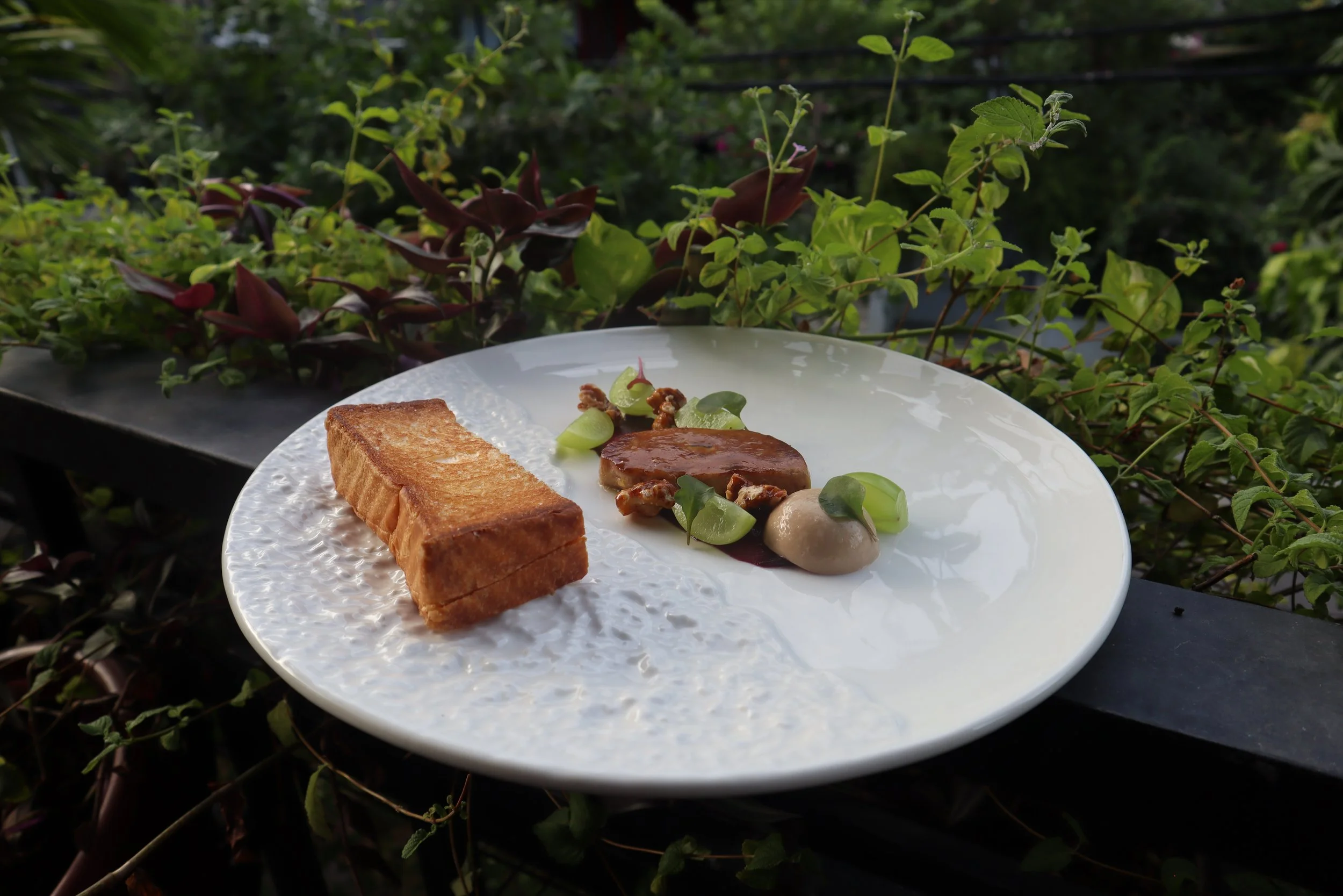 Perfect pan-seared duck foie gras, with homemade French butter brioche, a signature dish at Le Rendez-Vous, gourmet French restaurant in Da Nang, Vietnam