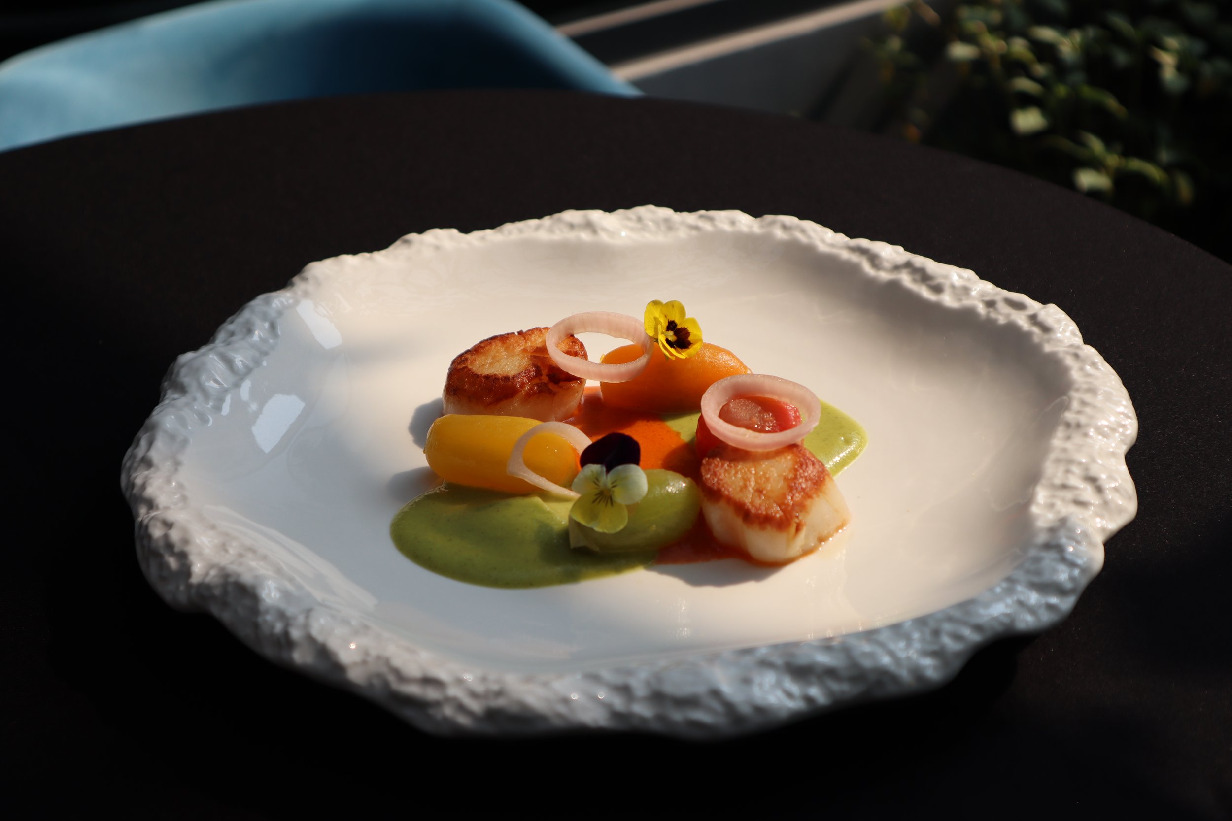 Perfect pan-seared Japanese scallops, one of the signature dishes at  Le Rendez-Vous, gourmet French restaurant in Da Nang, Vietnam