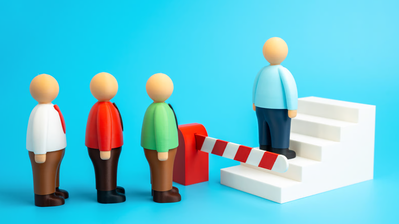 Queue of colorful figures waiting behind a barrier next to a white staircase