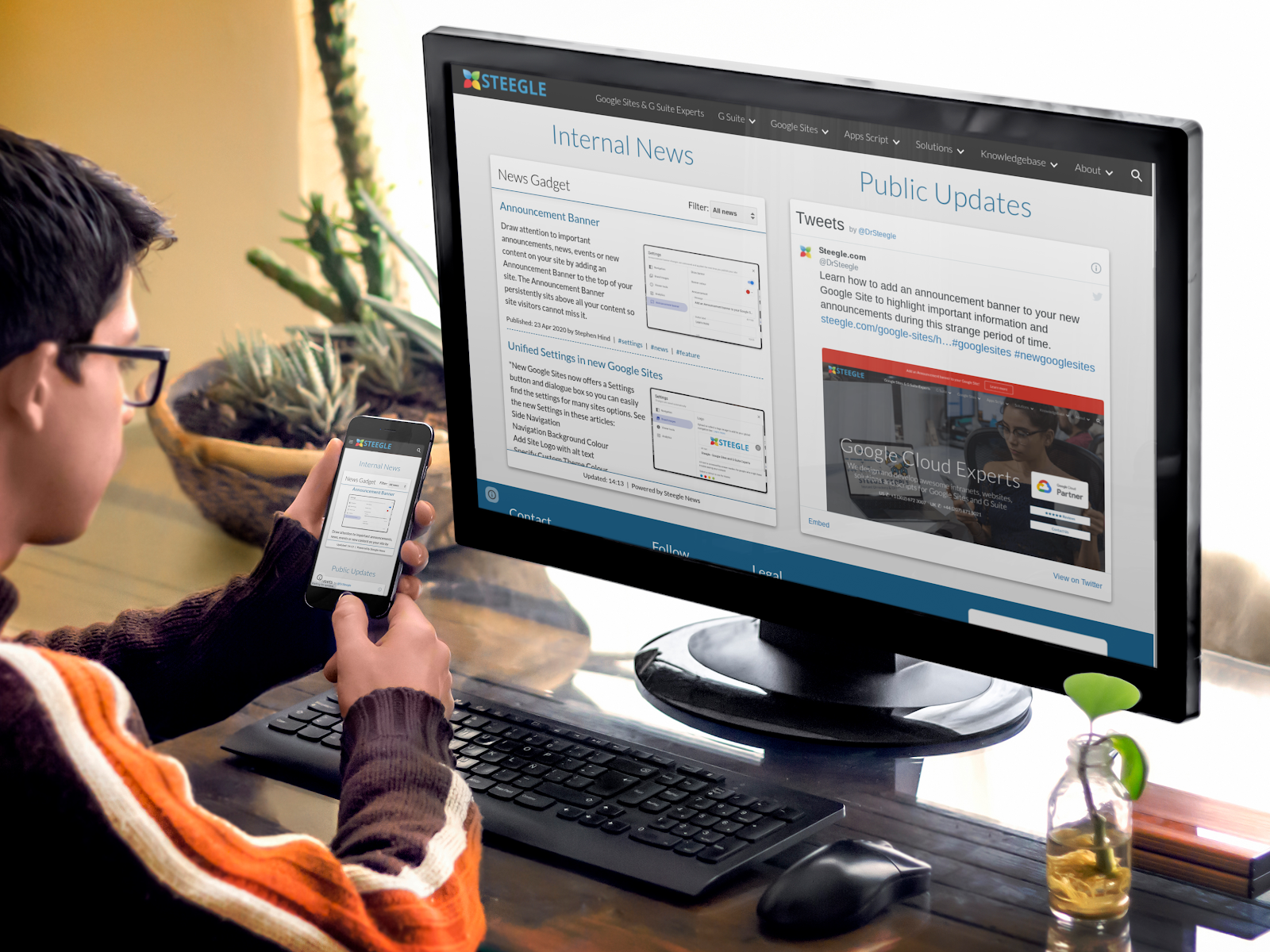 A person at a desk viewing an internal news portal on both a computer monitor and a smartphone. The screen displays the Steegle News Gadget on a Google Sites page, highlighting announcements and public updates in a responsive layout.