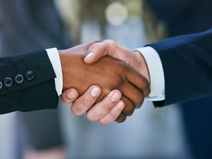Two people shaking hands.
