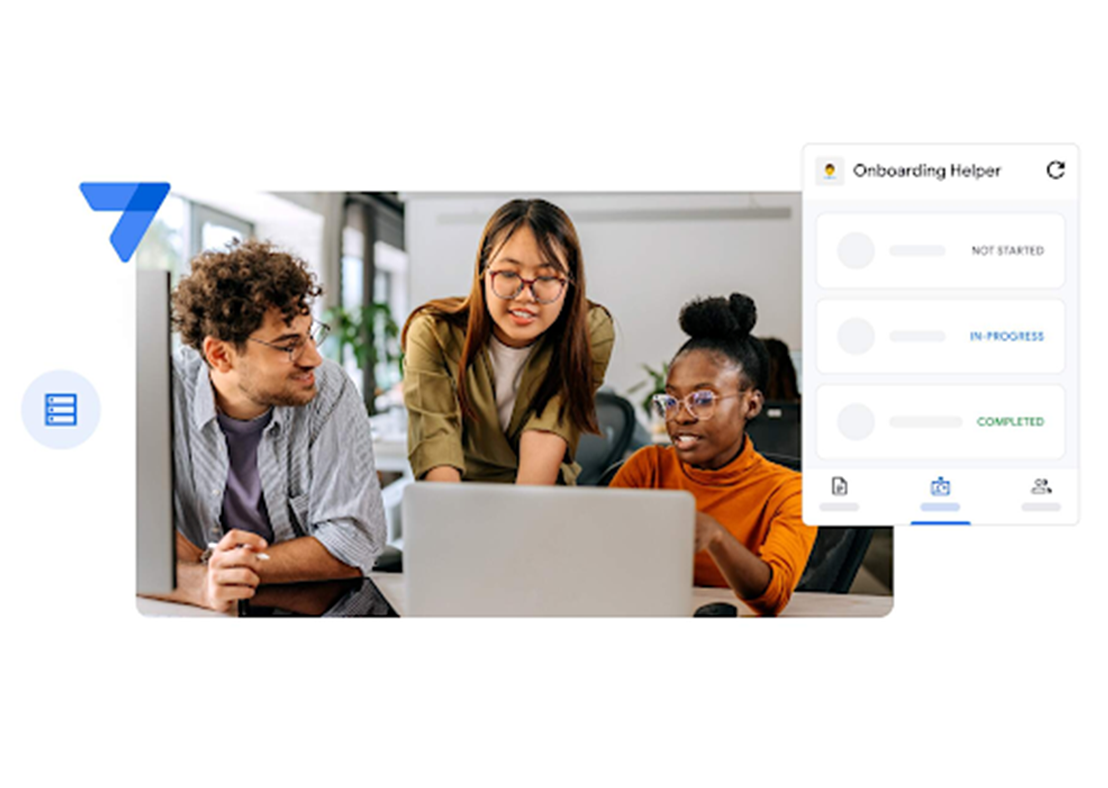 Three employees gathered around a laptop developing an AppSheet onboarding app.