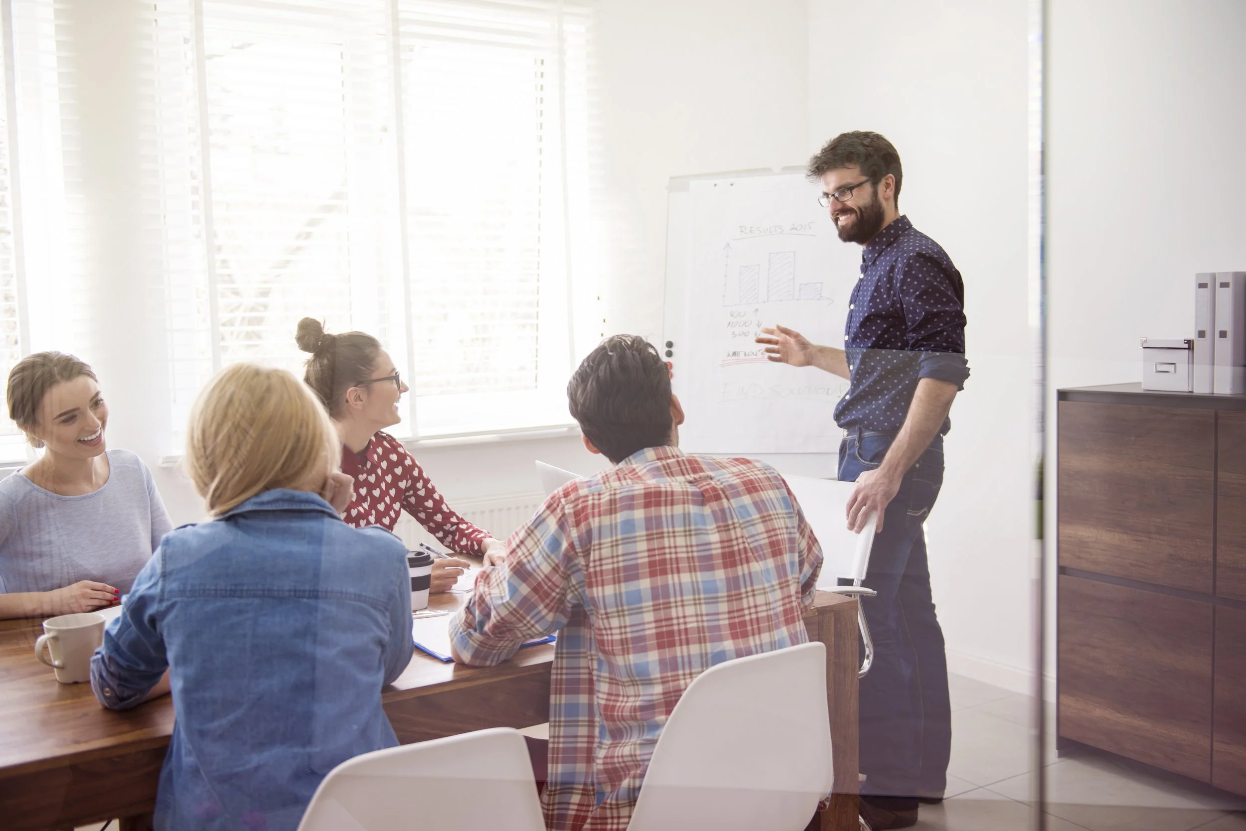 Man presenting something to his colleagues