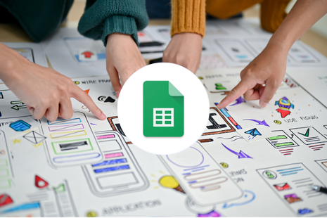 Team pointing whats to be done with the google sheet in the middle