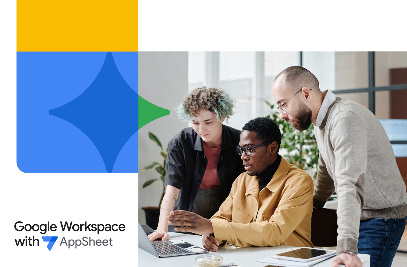 Group of employees gathered around a laptop, working together in Google Workspace with AppSheet