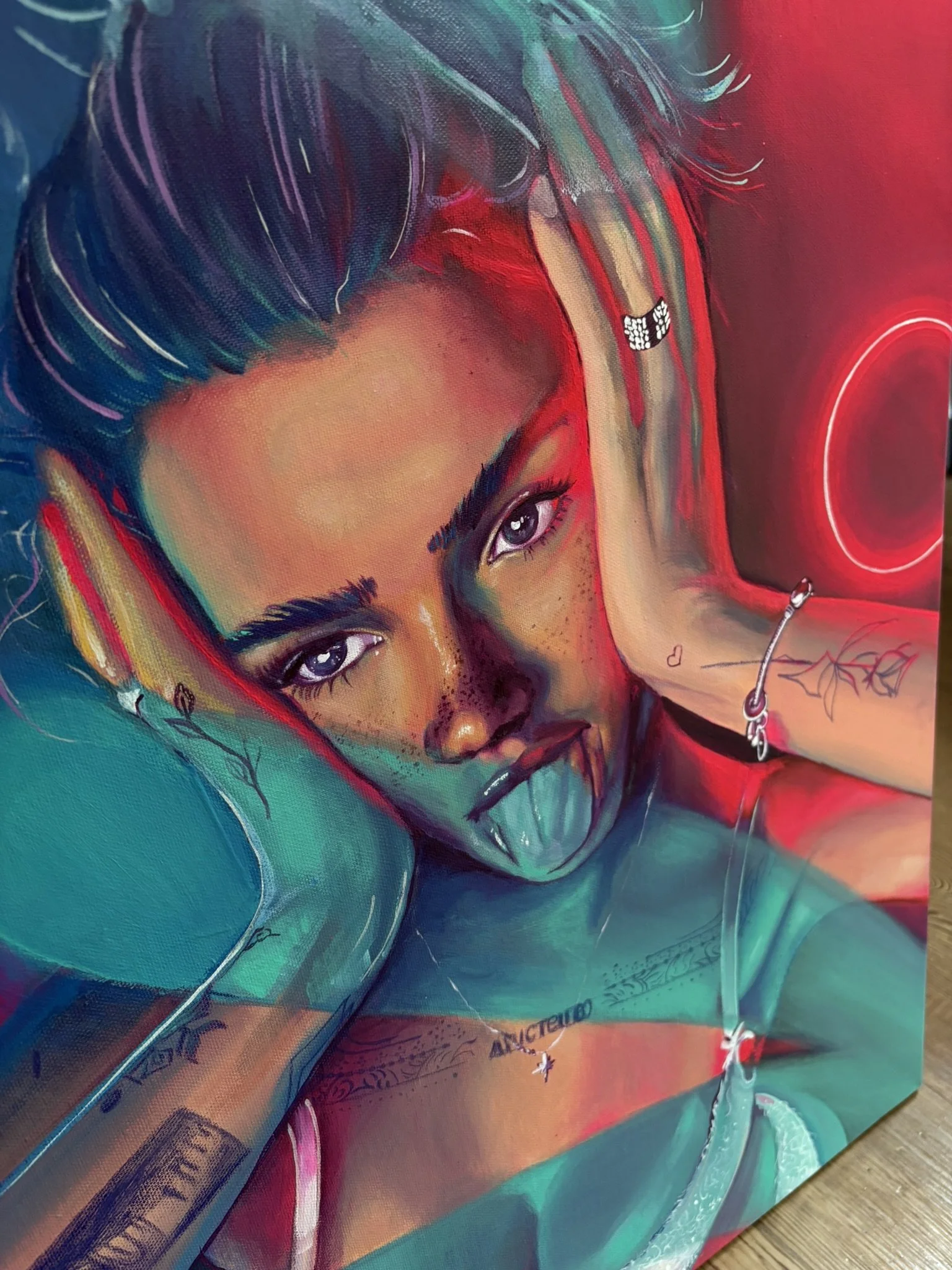 A vibrant acrylic painting of a woman with multicolored hair and tattoos, sticking out her tongue, with neon lights in the background.