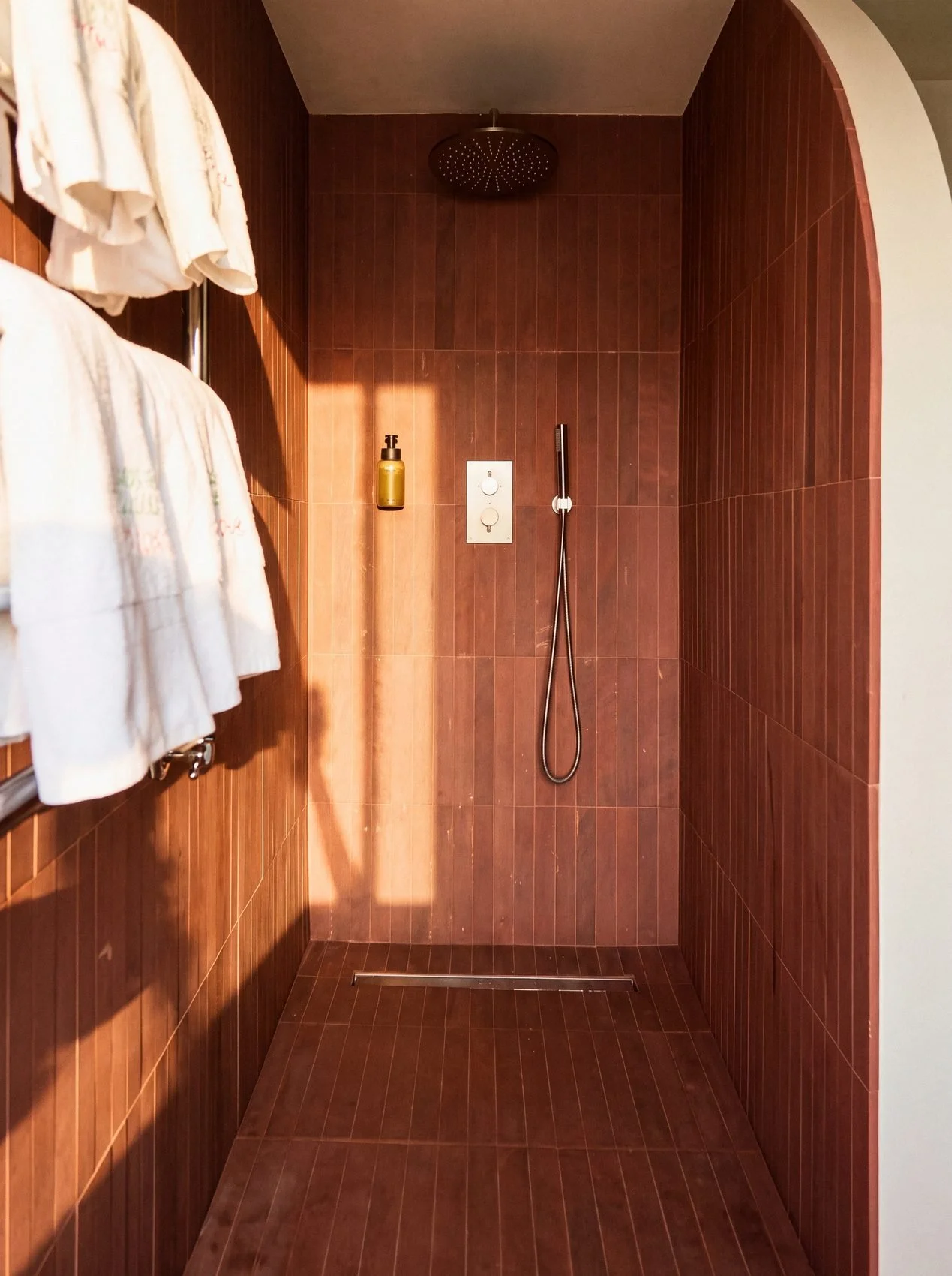 21_terracotta-tiled-shower-robes-portrait.jpg
