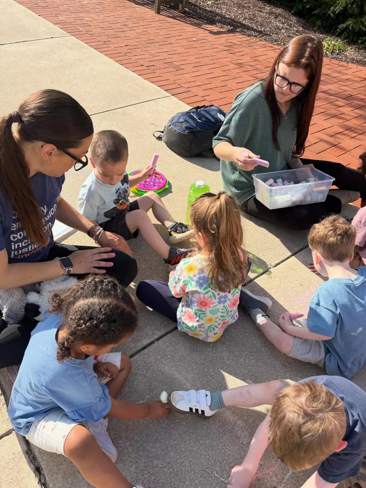 Sunny days + sidewalk chalk = learning in full color ☀️🎨

Our two-year-olds took advantage of the beautiful weather by heading outside for some chalk time&mdash;and while it looked like simple fun, there was so much important learning happening! Hol