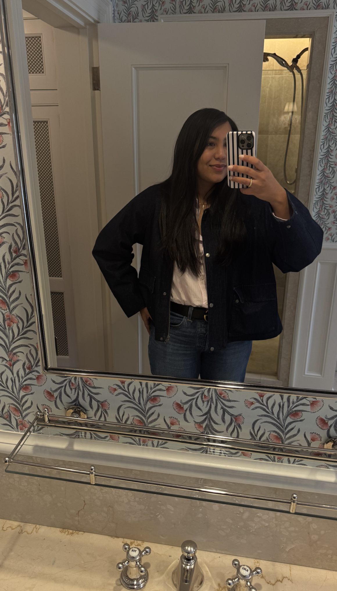 Woman taking a mirror selfie during an anniversary getaway at the Mayflower Inn.