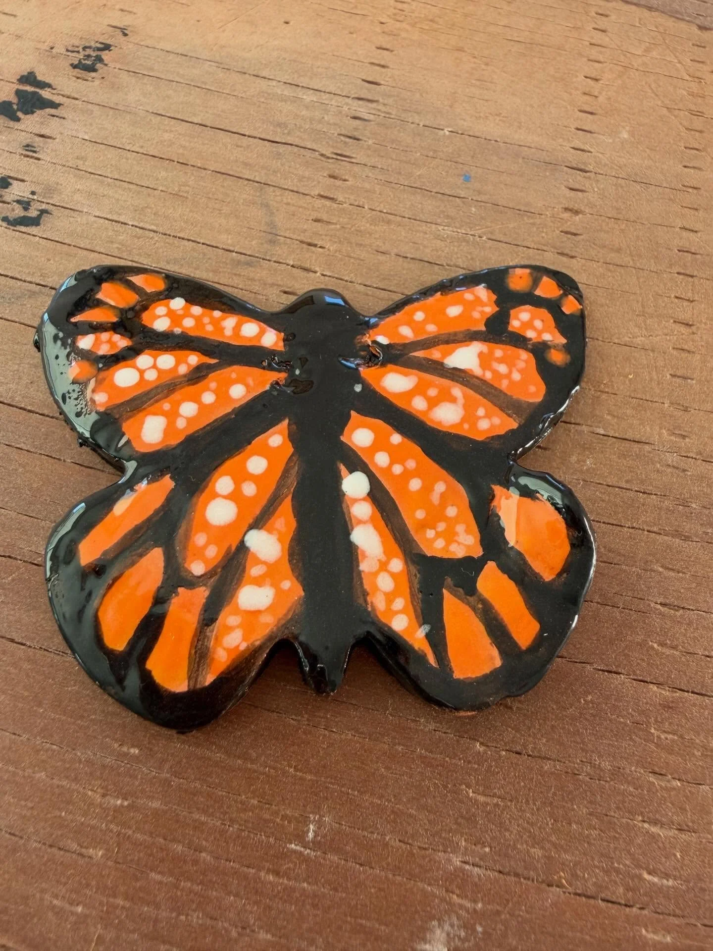 Look at the glazing on this beautiful butterfly. #pottery #potterystudio #glazing #potterynearme
