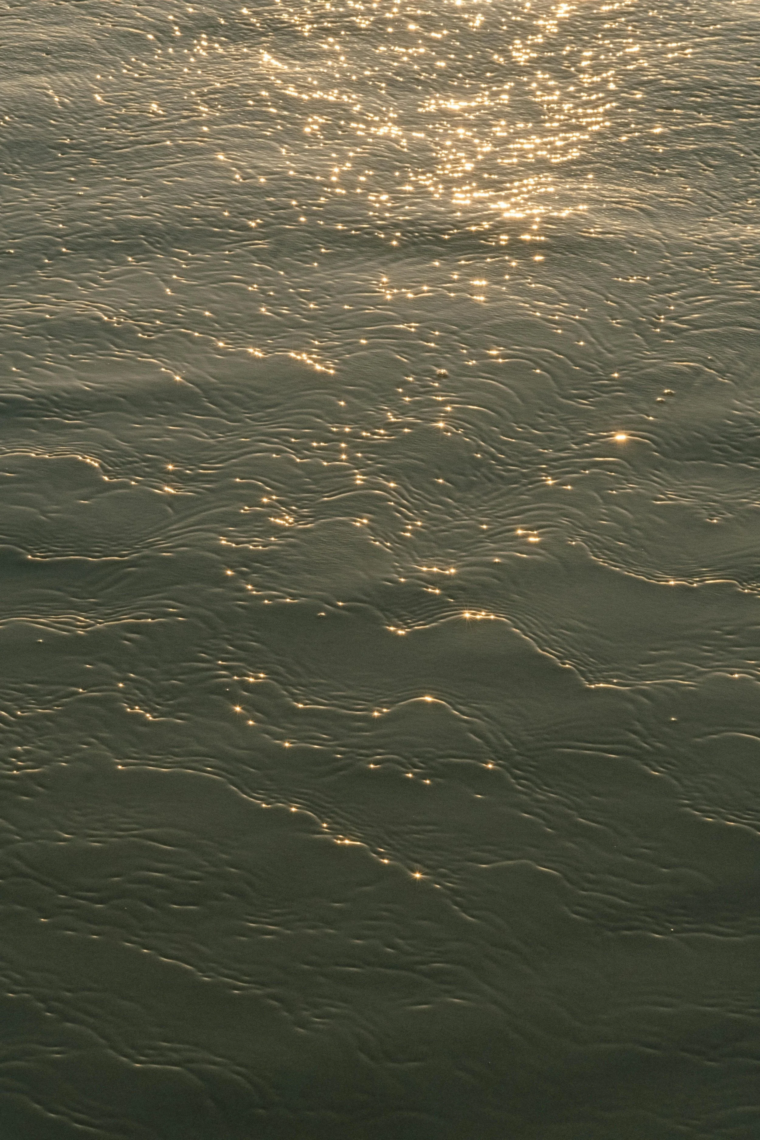 MSunlight on ocean waves, featured in the Background, Training, and Fees section of Catherine Alvarado, LMFT’s website.