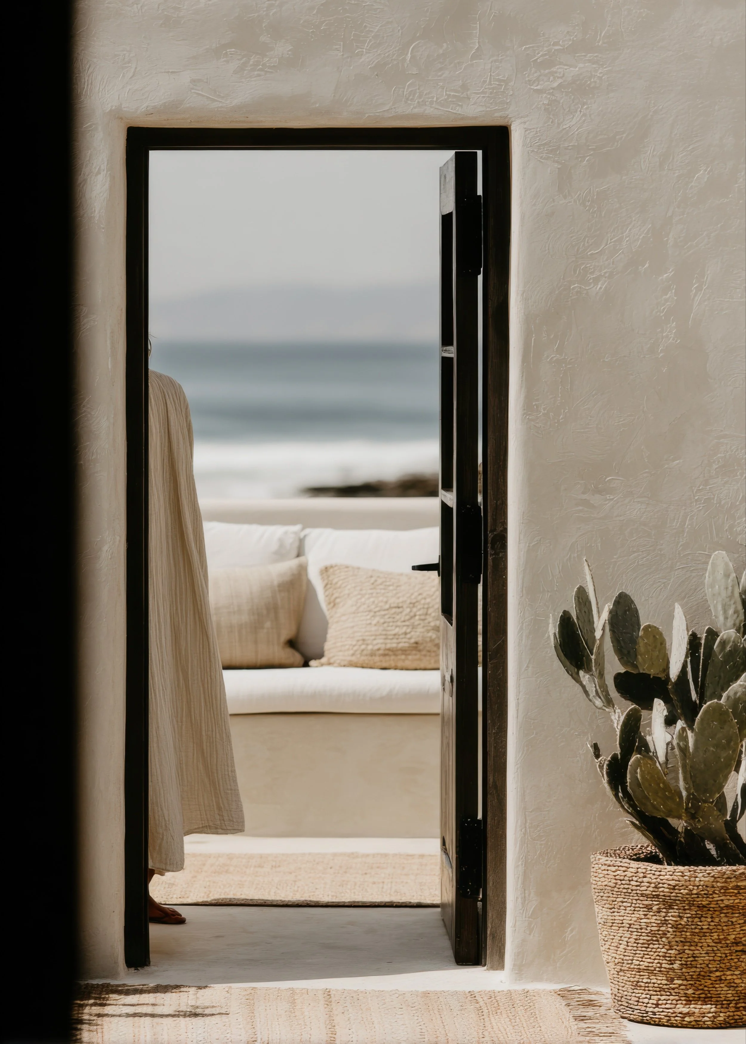 Calm coastal interior with soft natural light and grounding neutral tones
