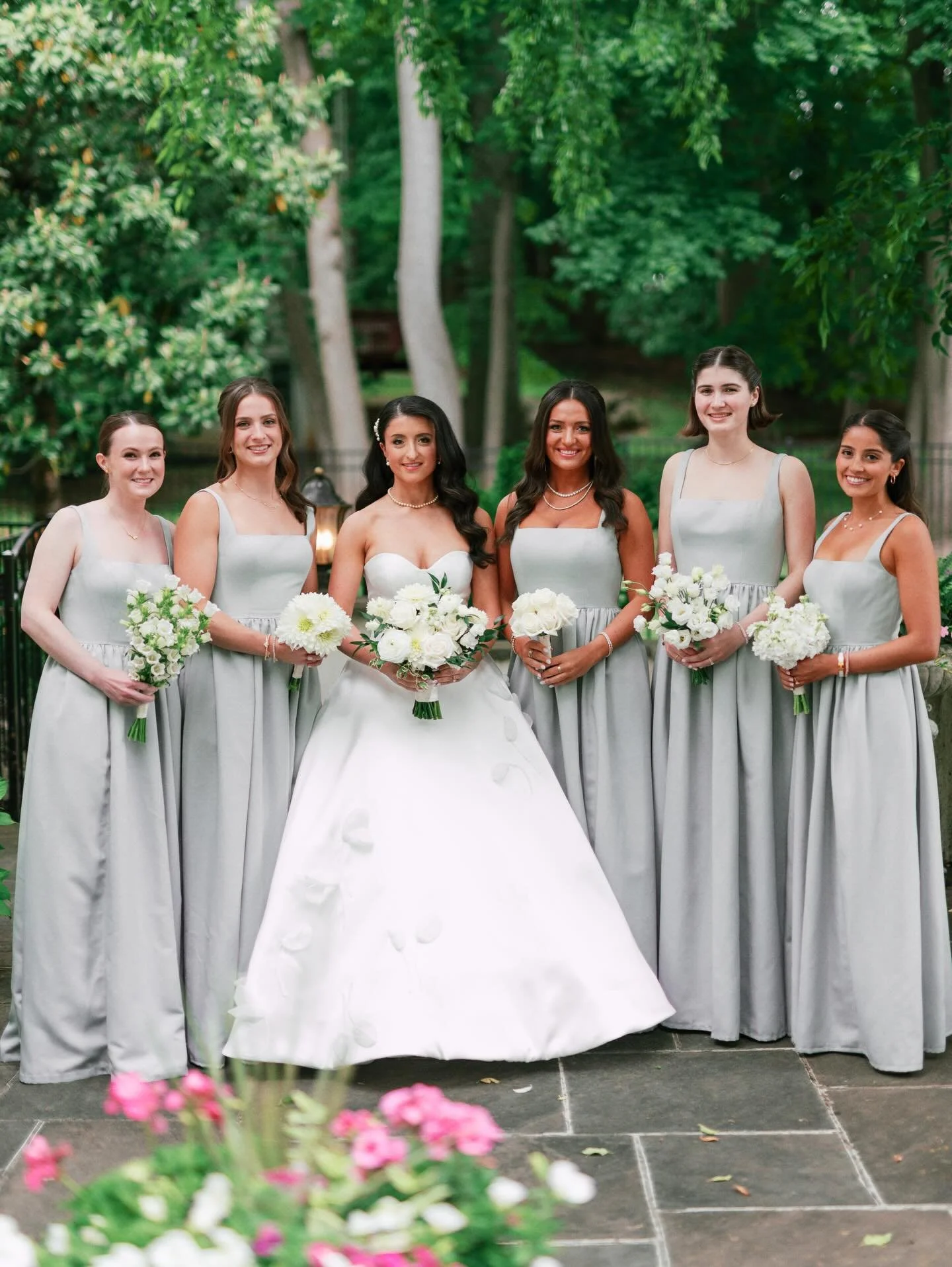 Looking for a modern twist without sacrificing a timeless and classic look? Single-variety bridesmaids bouquets are the best of both worlds! Keep this trend coming.

#wedding #florist #bridalbouquet #floraldesign