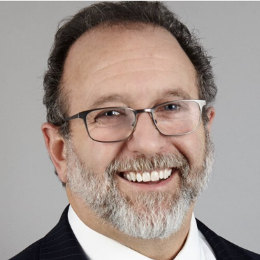 Man with glasses smiling