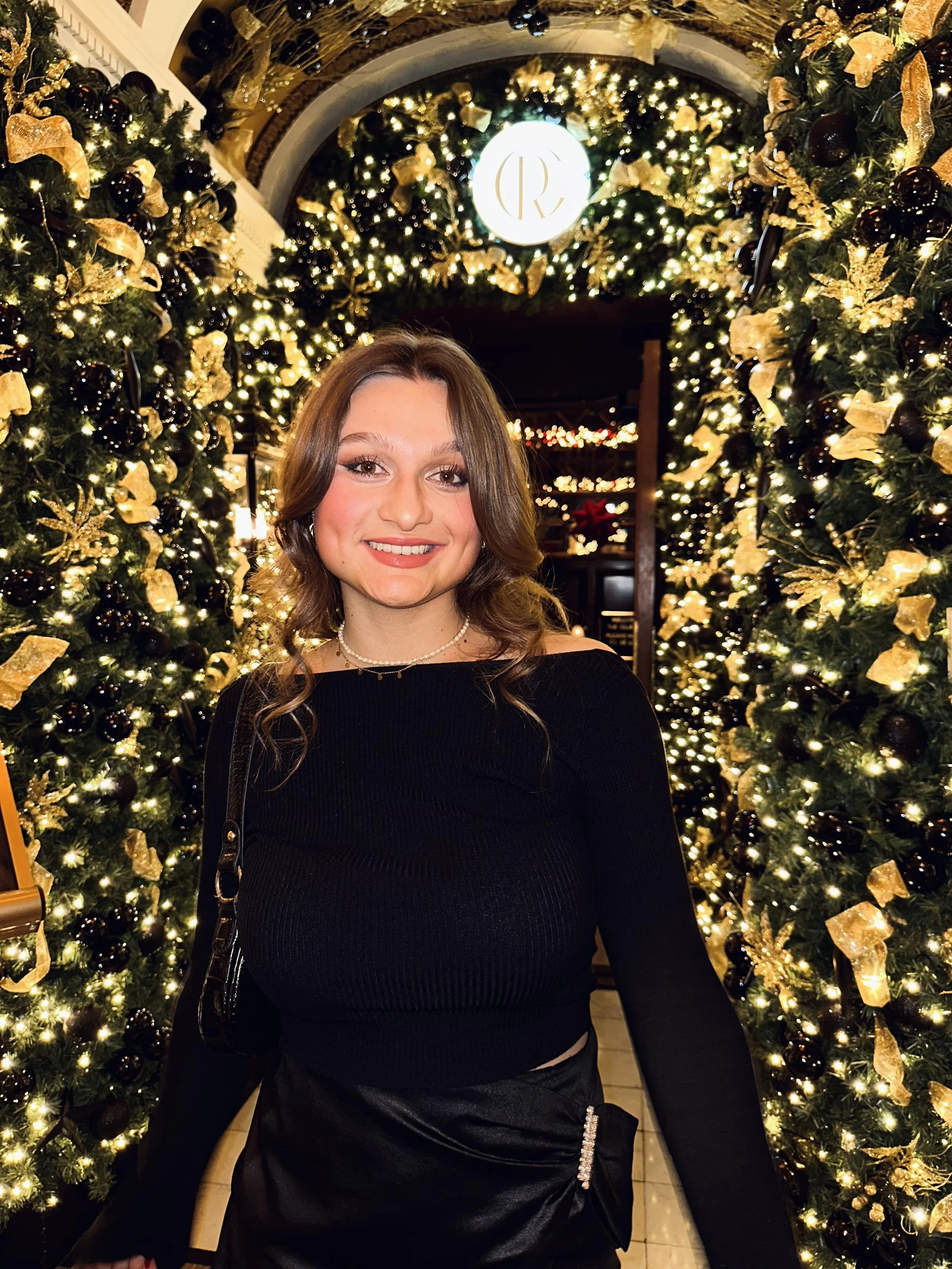 A woman wearing a black Christmas Outfit at The Dome, Edinburgh