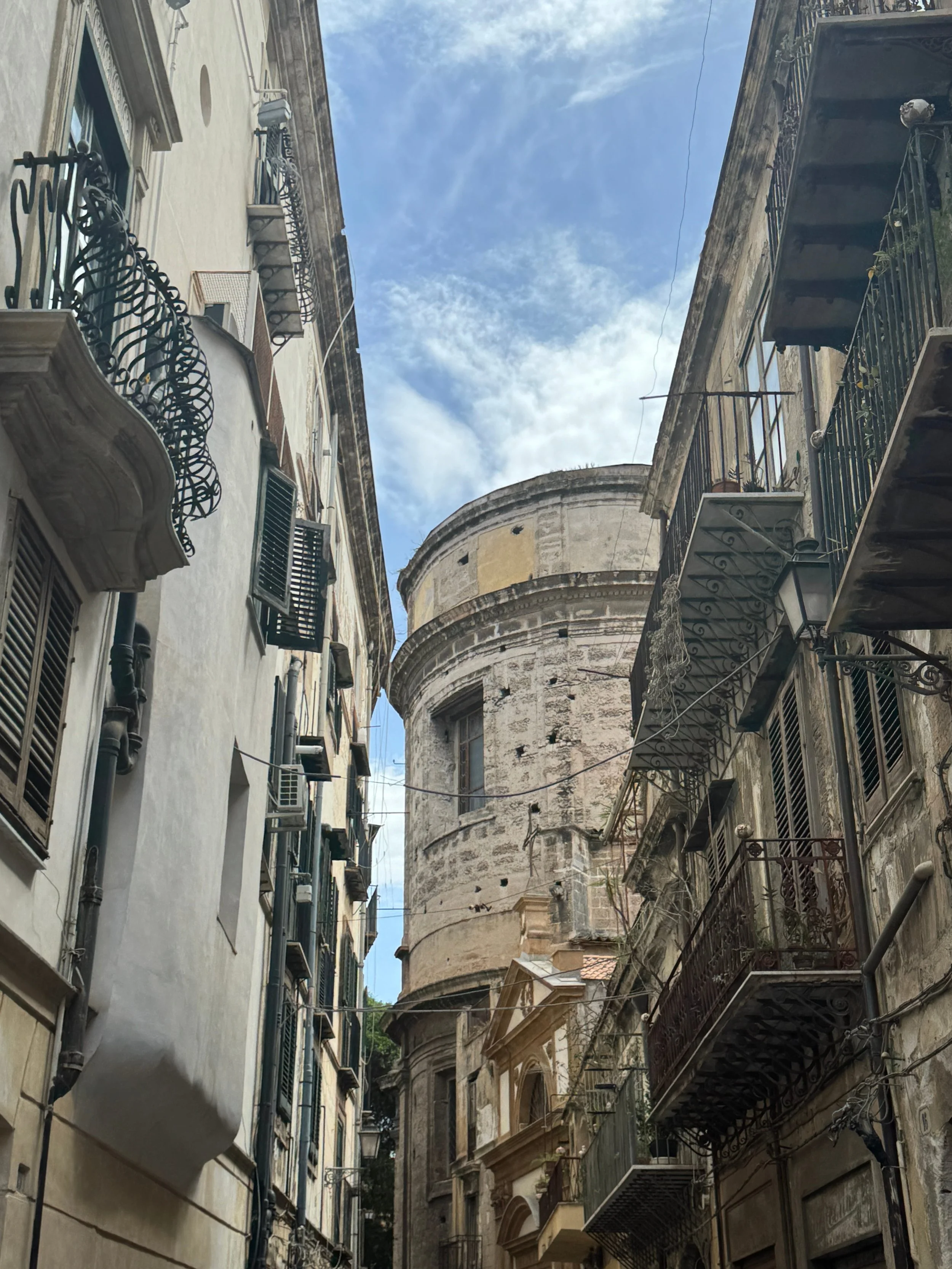 Stone architecture and balconies that line the streets in Palermo, Sicily