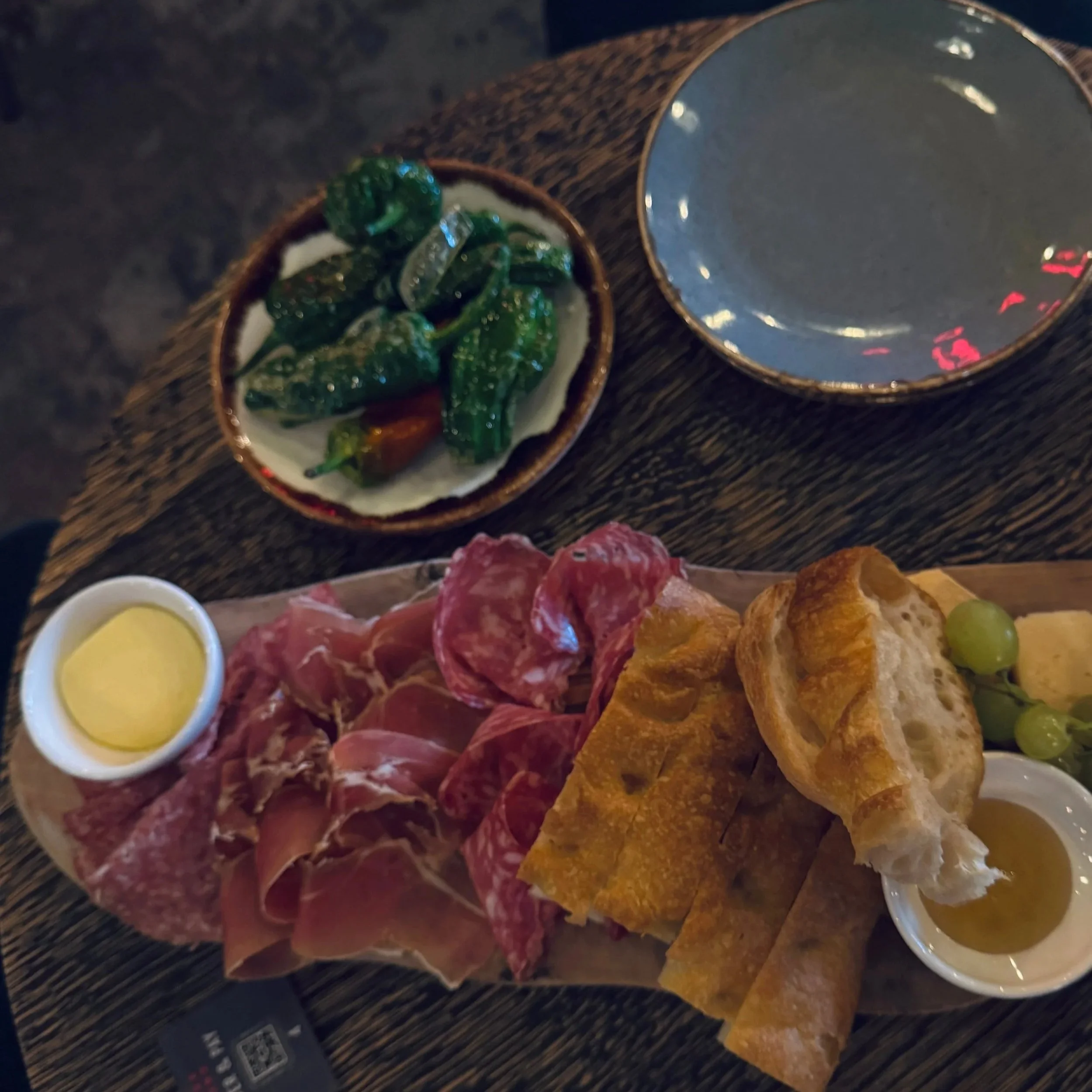 A beautifully arranged charcuterie platter with various meats and cheeses