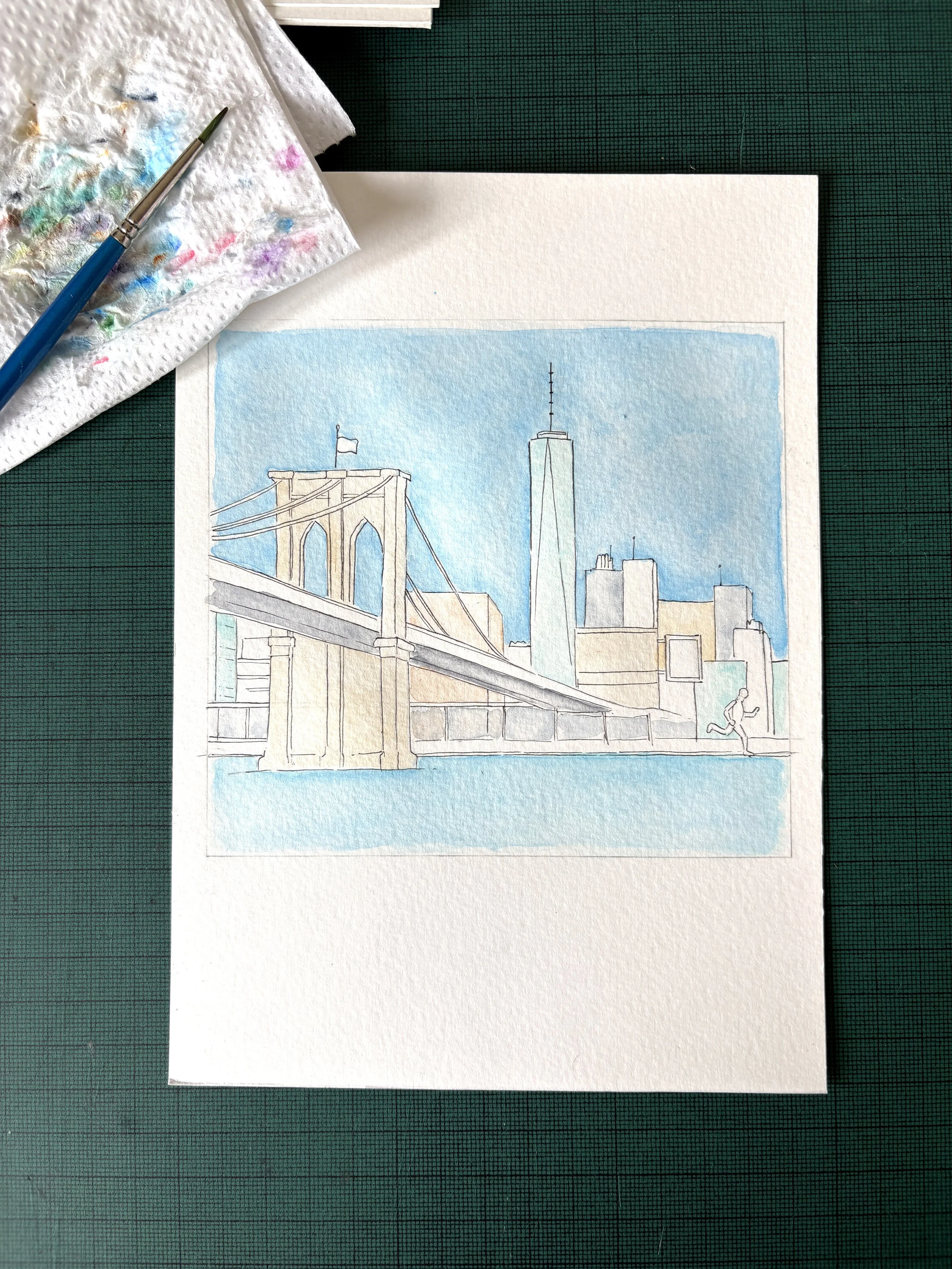 Progress image of a watercolour illustration of New York, showing several major landmarks and personal details relating to the couple.