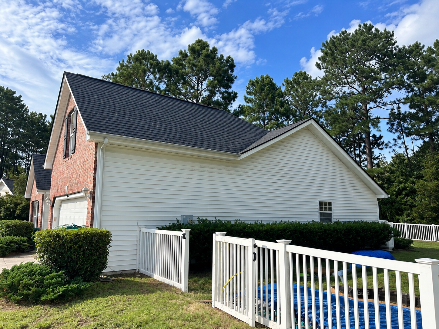 Completed roof replacement by Bear Roofing LLC featuring Atlas Pinnacle Pristine Black Shadow shingles in Carolina Forest, SC