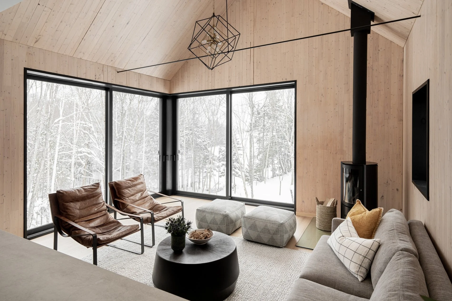 living area with Stûv wood stove and cross-laminated timber interior