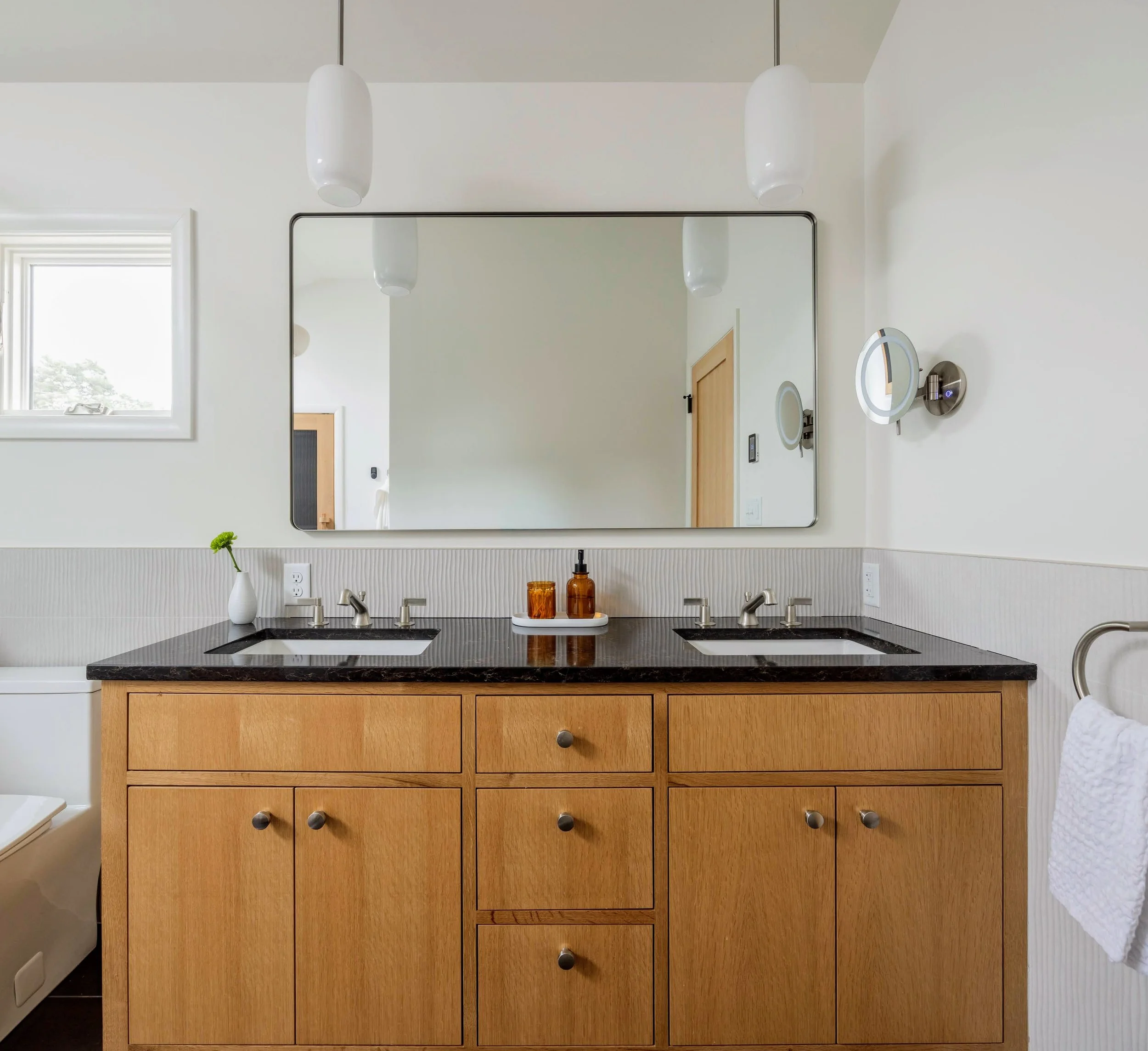 Sleek modern bathroom design with double sink and large mirror