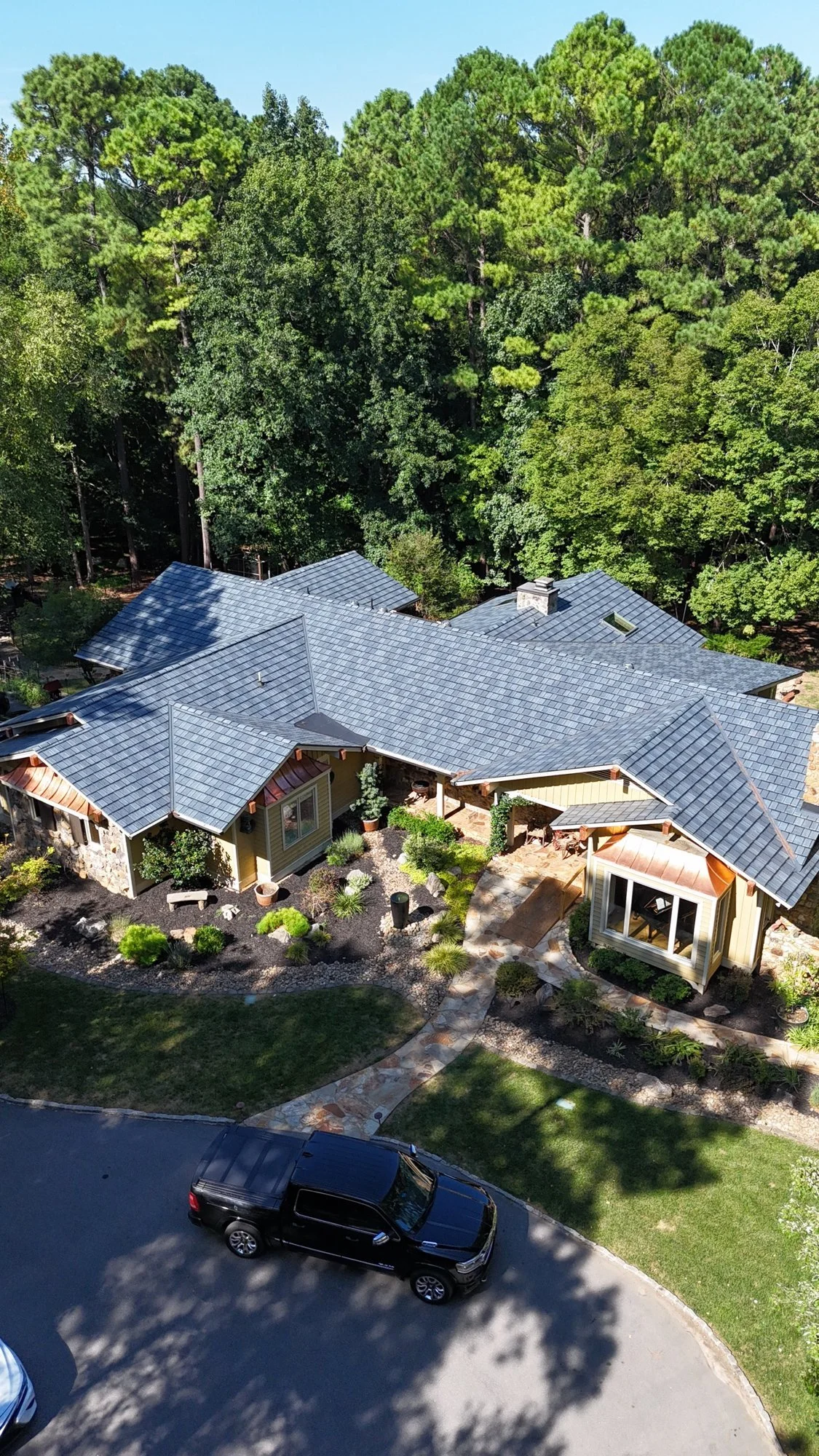 Completed roof replacement: a second drone view of the same home.