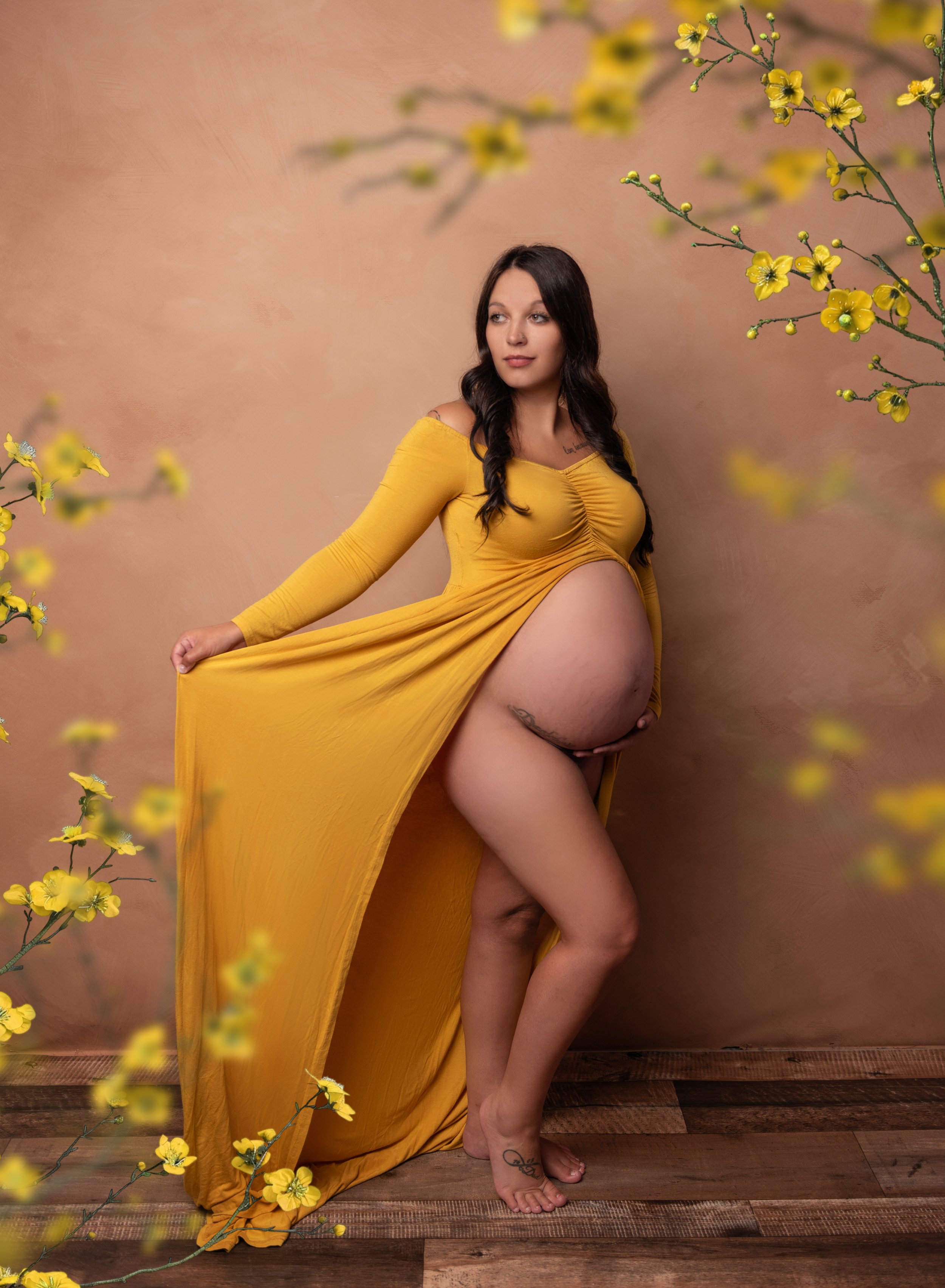 maternity photo of pregnant mom in mustard color dress