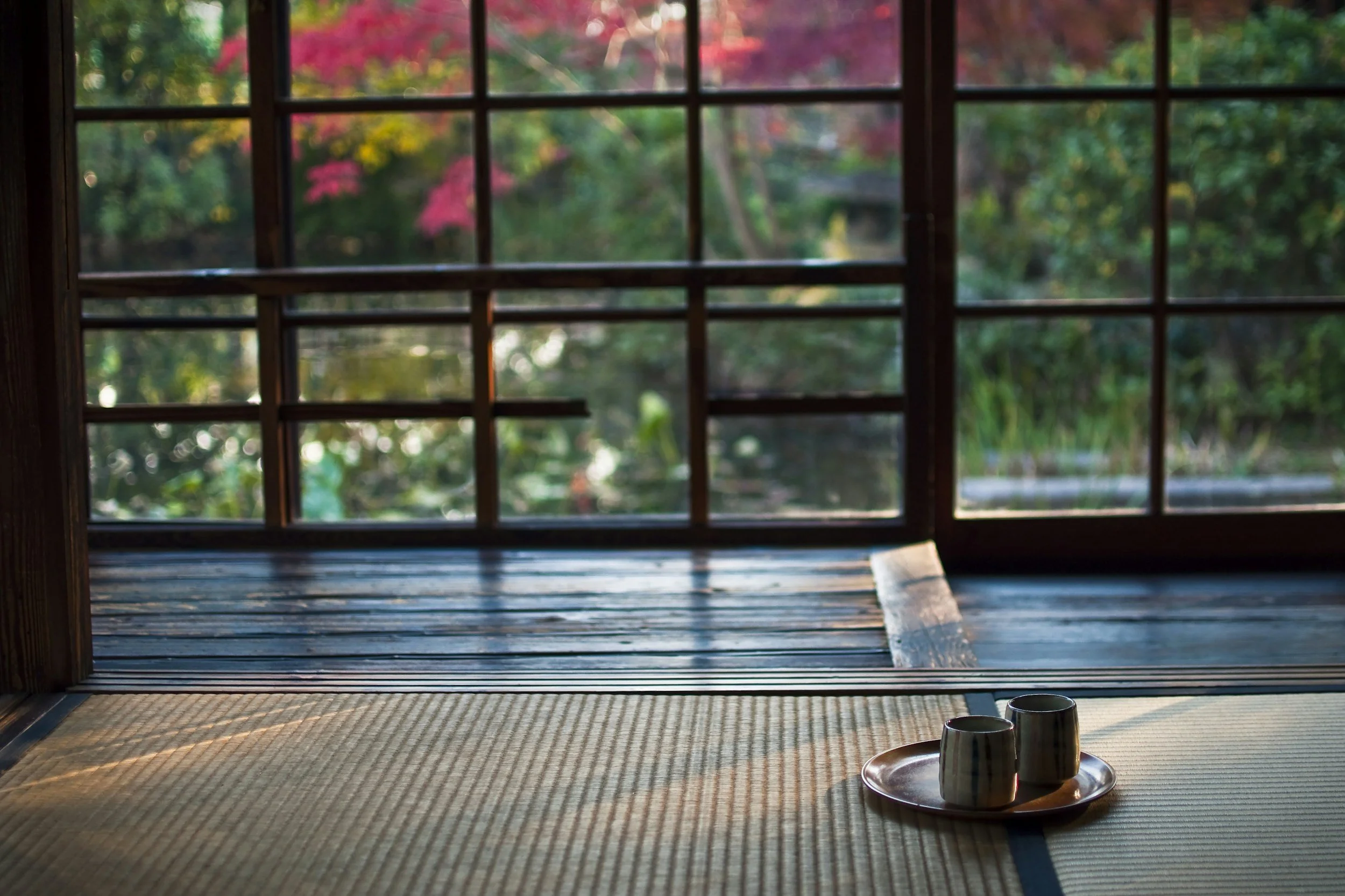 Cups of tea on a yoga mat