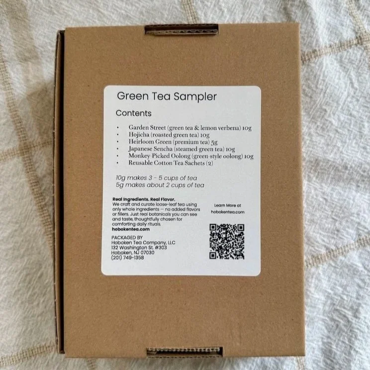 a brown cardboard box with a white contents label