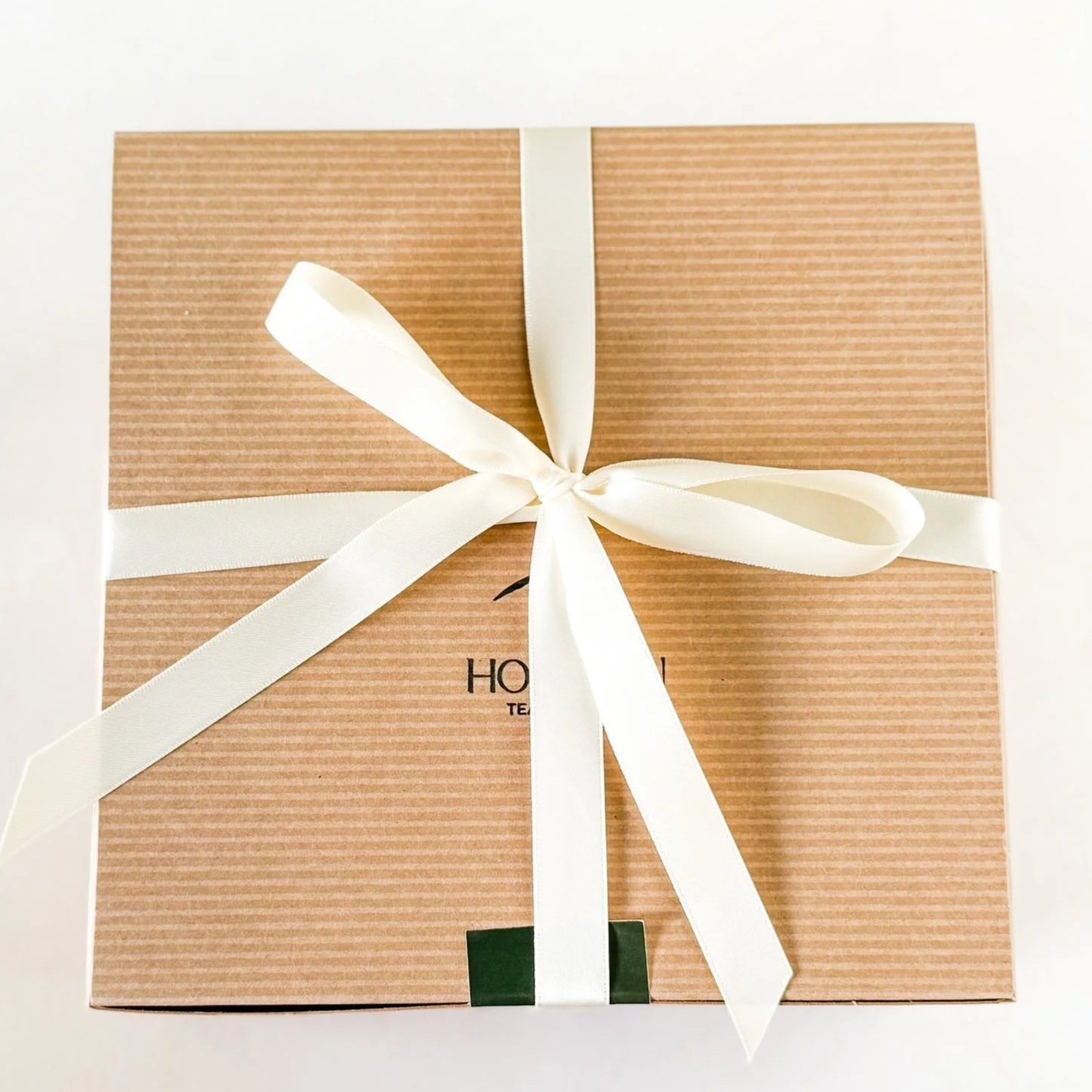 Brown Kraft gift box wrapped with a bow