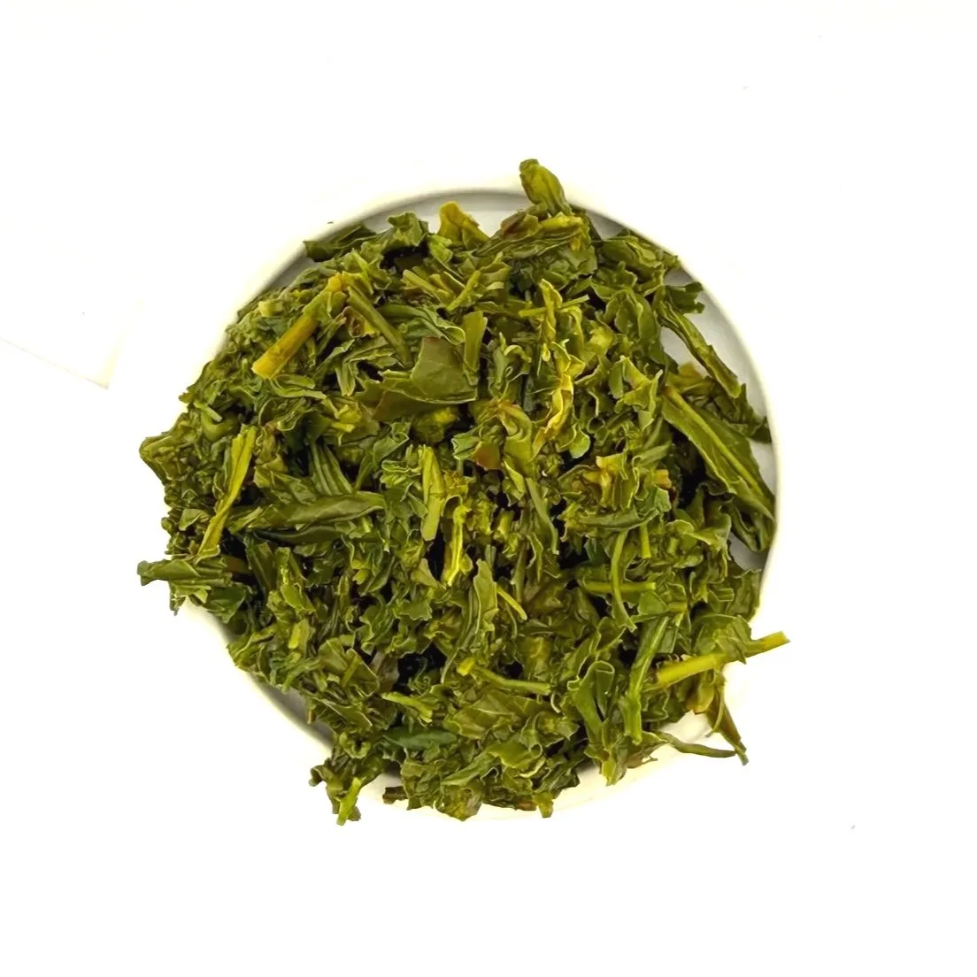 a closeup of green tea leaves after straining