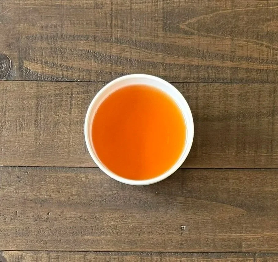 overhead view of a cup of Liberty Grey black tea on a wooden table