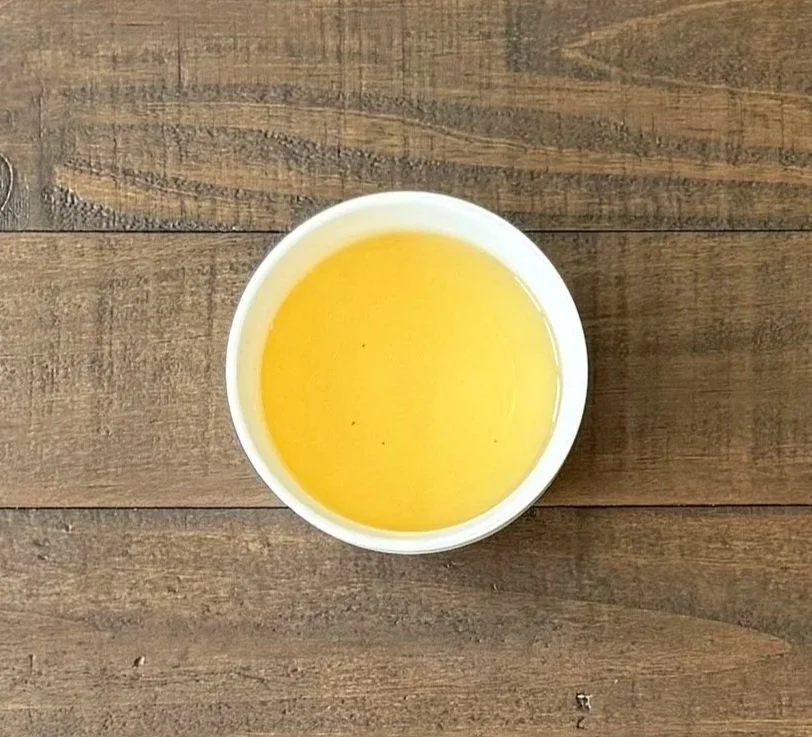 a cup of green tea on a wooden table
