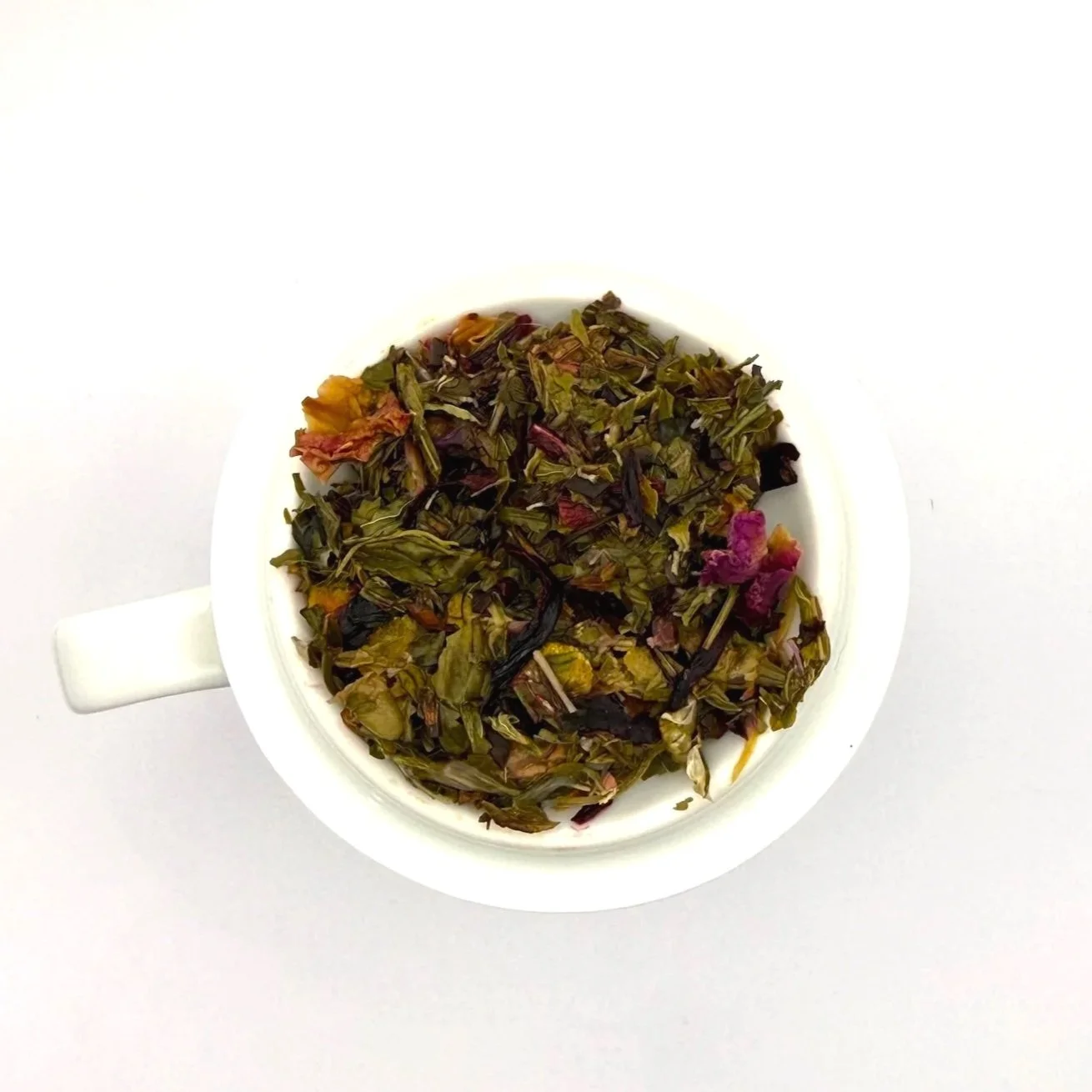 closeup of loose leaf herbal tea leaves after steeping and straining