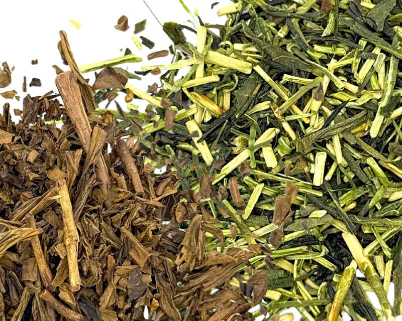 closeup of a pile of dried hojicha tea leaves next to a pile of dried kukicha loose leaf tea