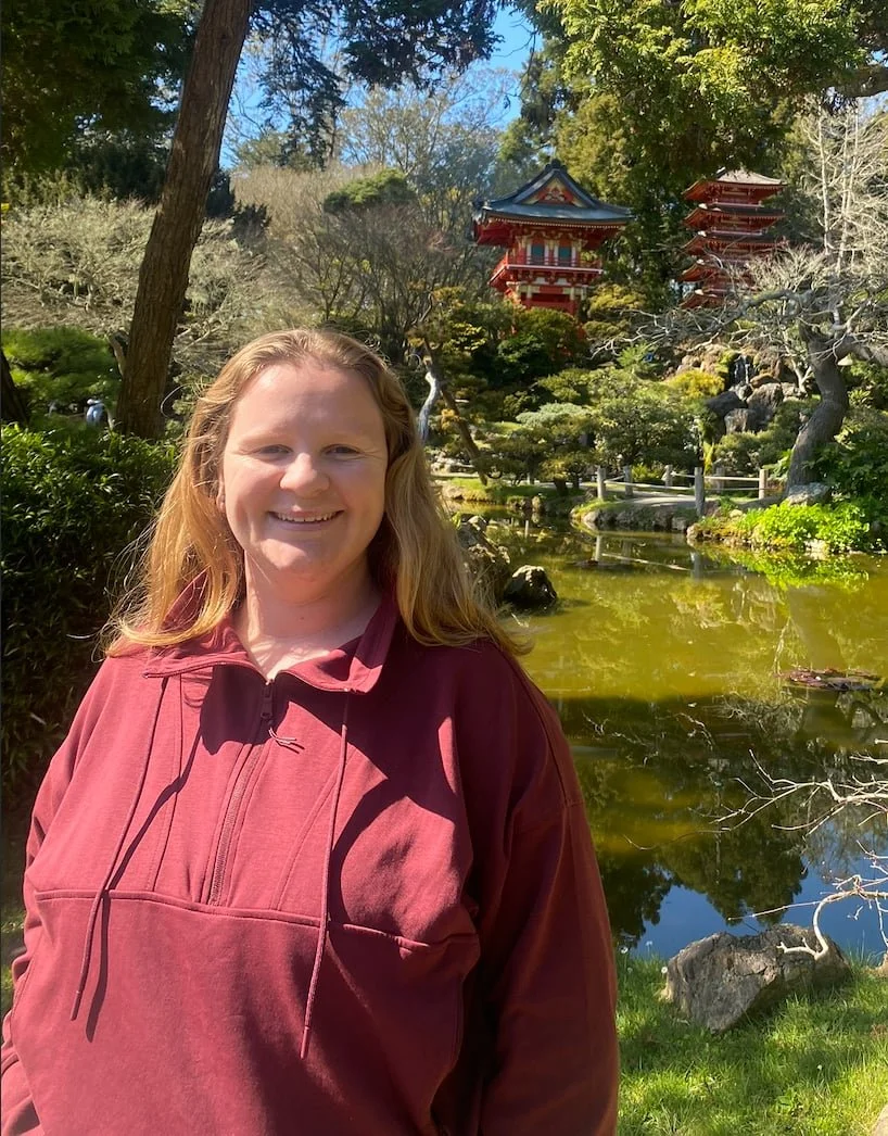 Anxiety therapist smiling at the Japanese Garden in San Francisco, CA