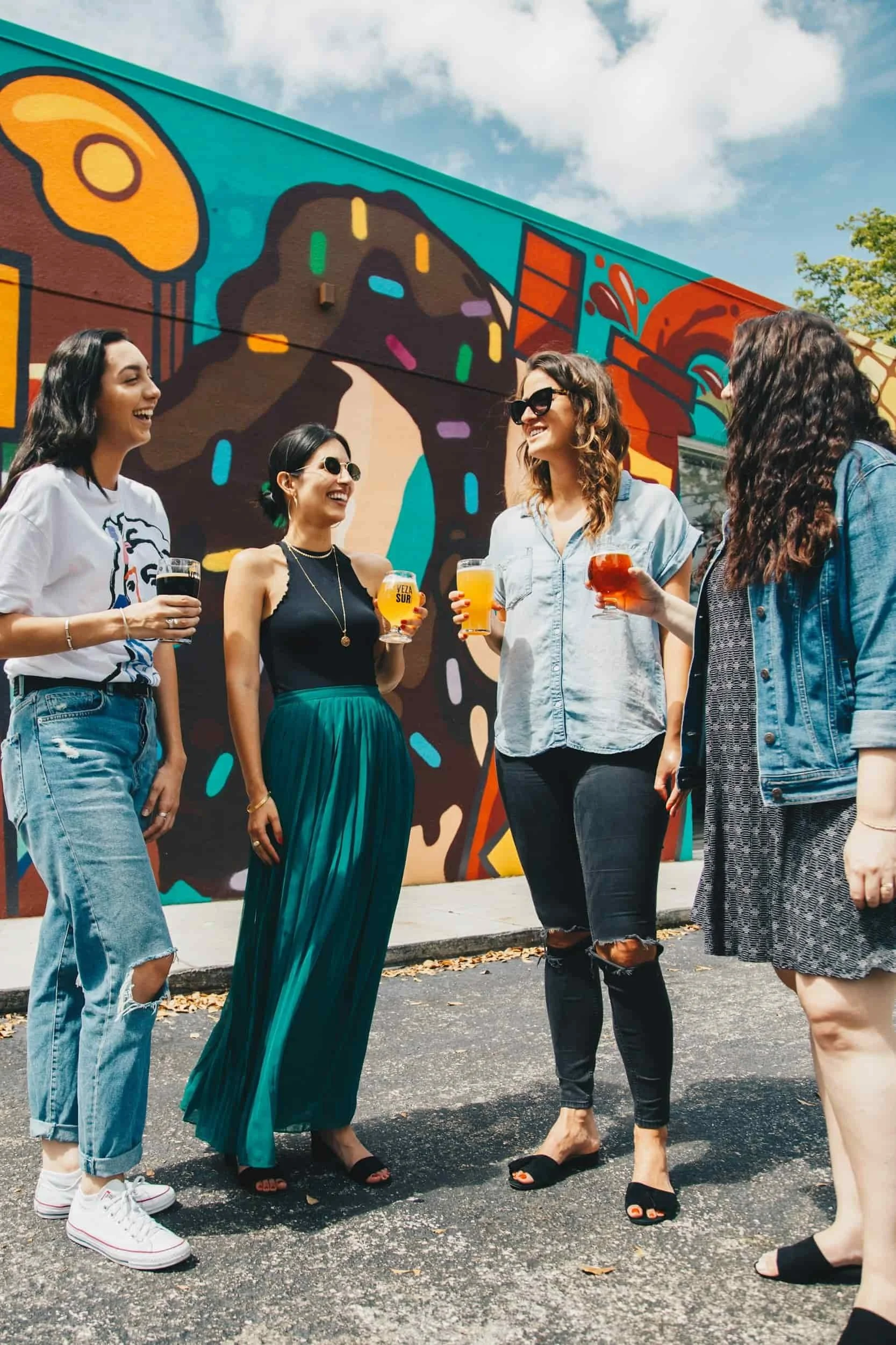 Group of women smiling after finding a stress and burnout counselor
