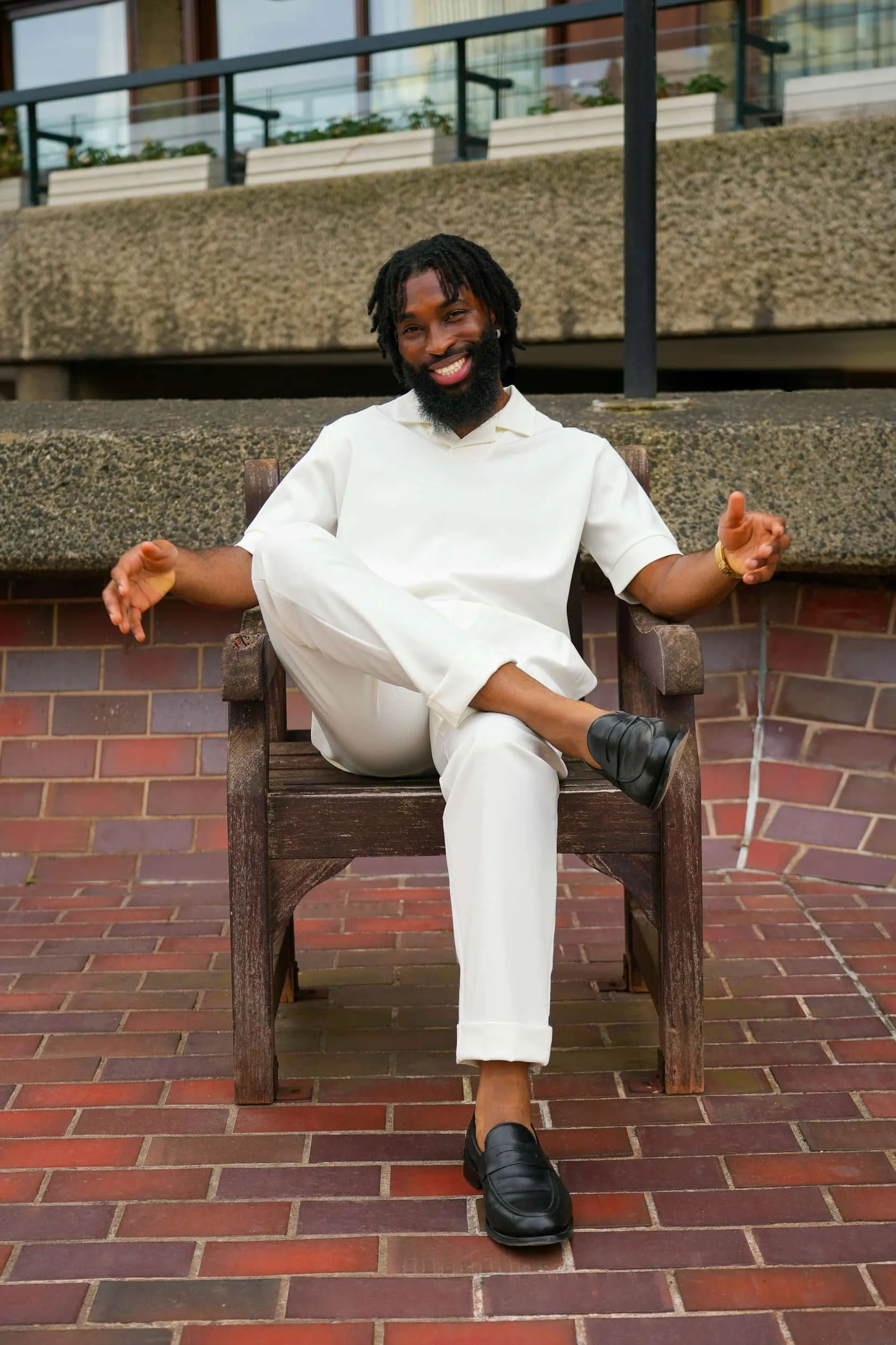 Smiling man sitting outside feeling calm after Perfectionism Therapy Burlingame, CA