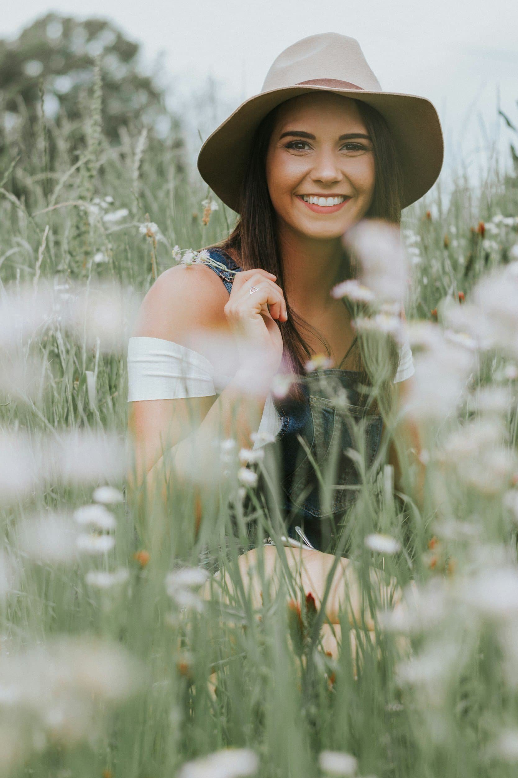 Woman smiling outdoors during a relaxed therapy session for anxiety