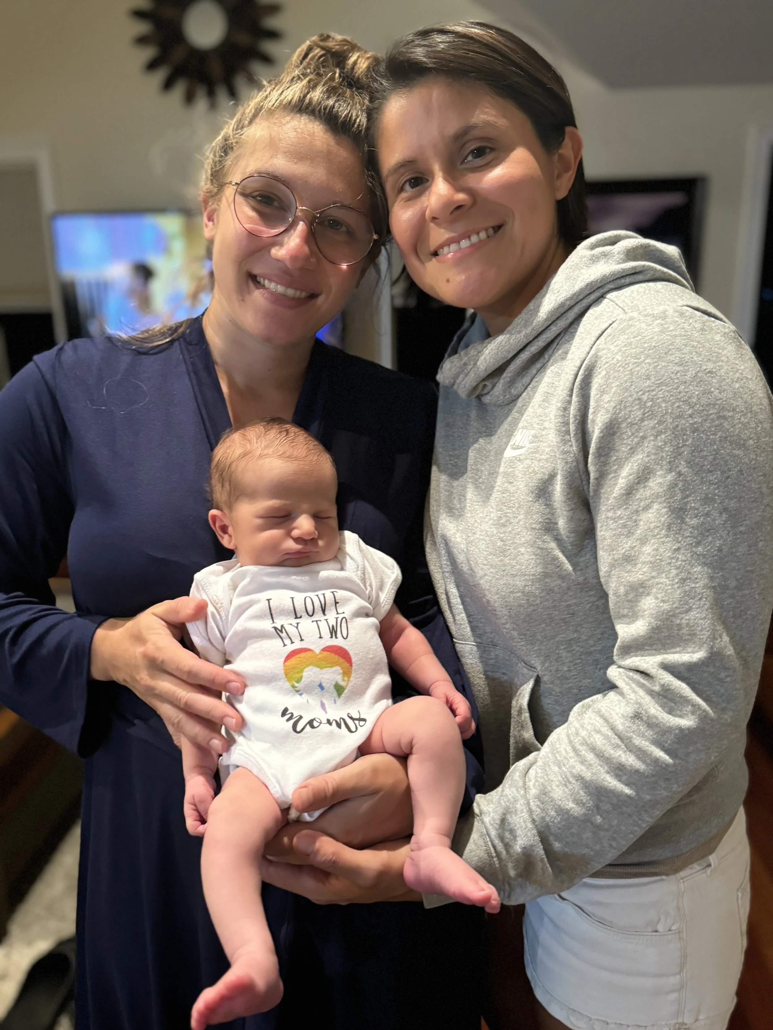 Parents holding baby.jpeg