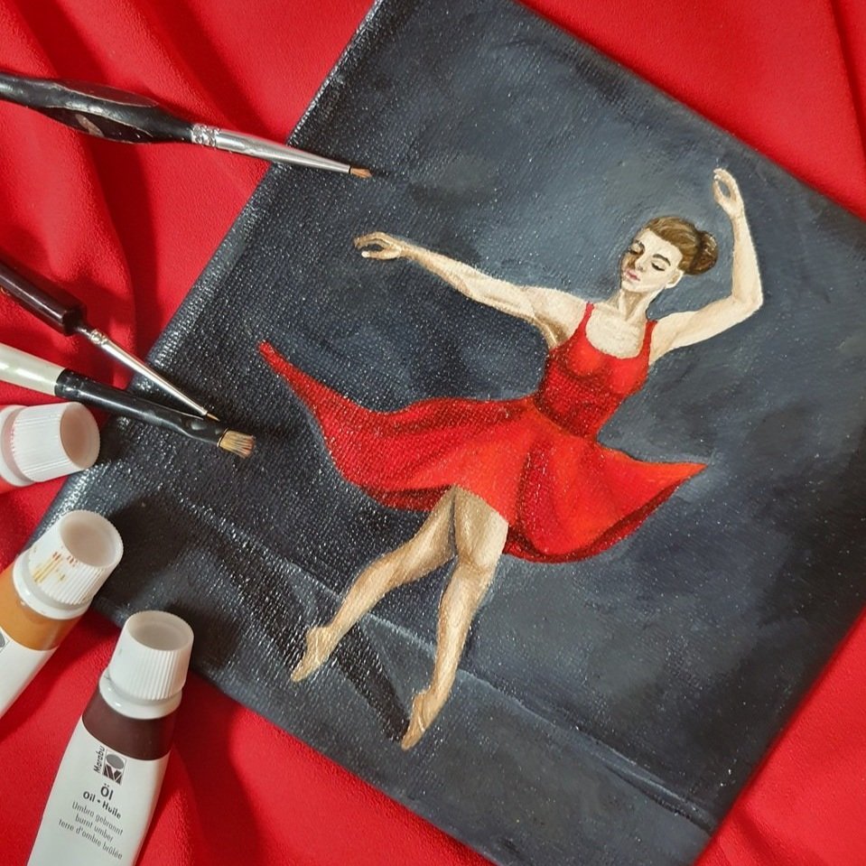 Handgemaltes Bild mit Ölfarben auf Keilrahmen. Eine Ballerina tantz in einemroten Kleid vor schwarzem Hintergrund. Ästhetisches Bild für alle die Tanz und Bewegung lieben