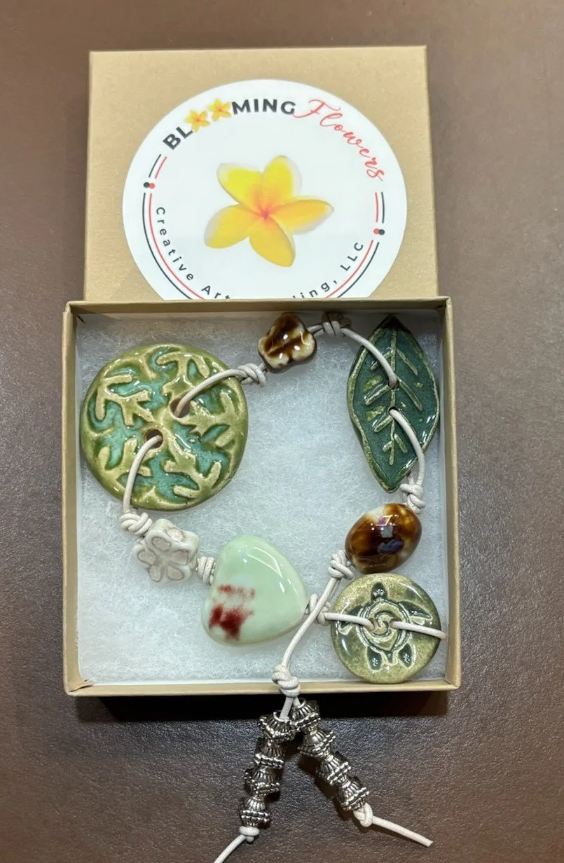 BLOOMING GREENS AND HEART BRACELET ON WHITE LEATHER.jpg