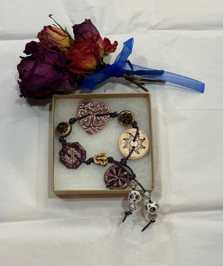 BLOOMING PURPLE HEART BRACELET ON PURPLE LEATHER.jpg