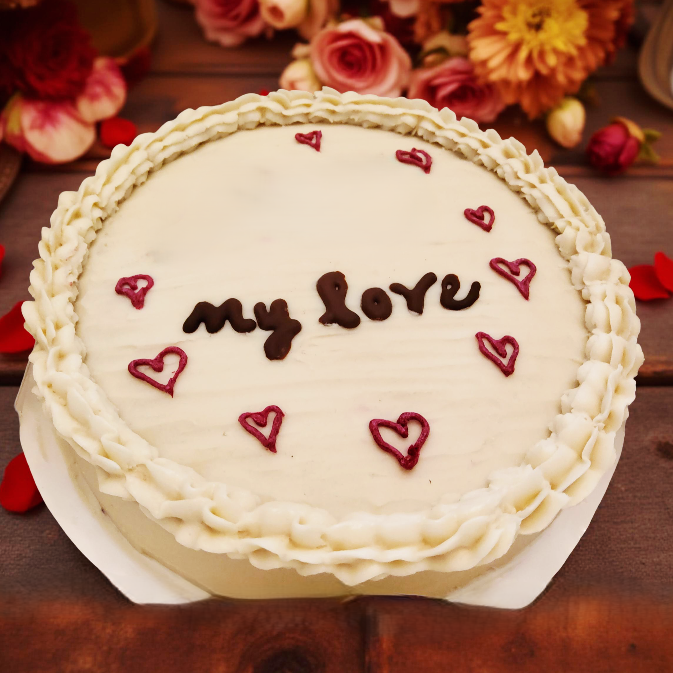 8-inch single layer vegan round cake with heart accents.png