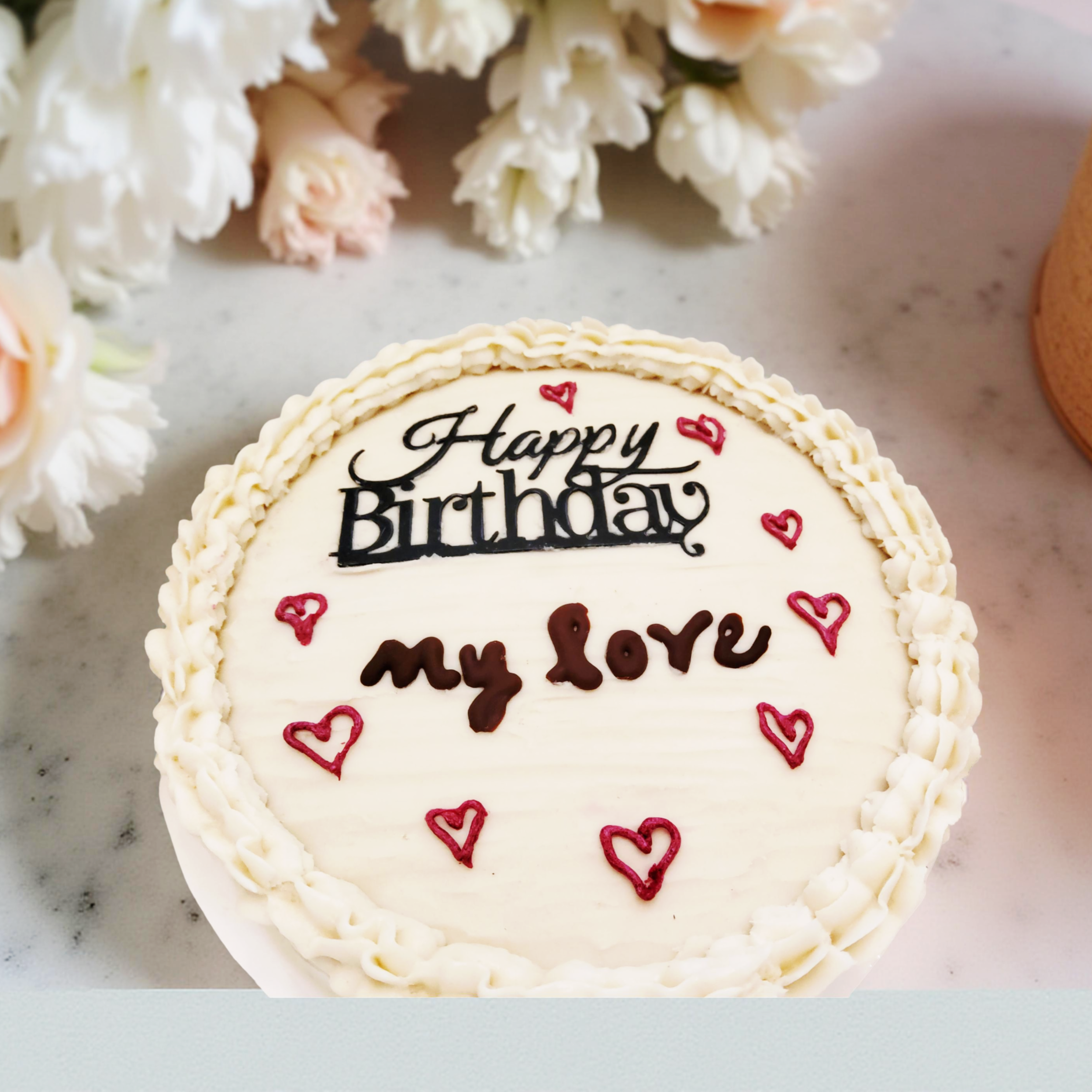 Plant-based single layer/8-inch round/vanilla cake/vanilla frosting/heart accents