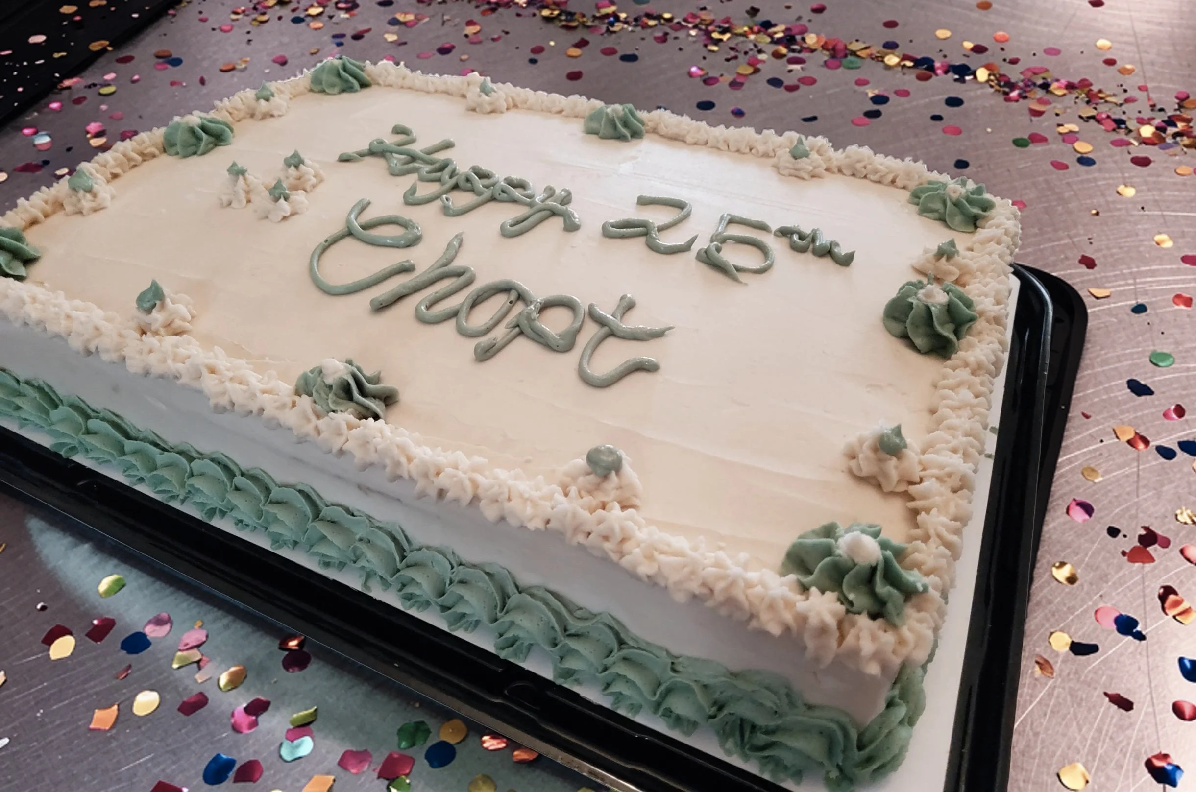 Plant-based vanilla 1/4 sheet cake with green and white accents