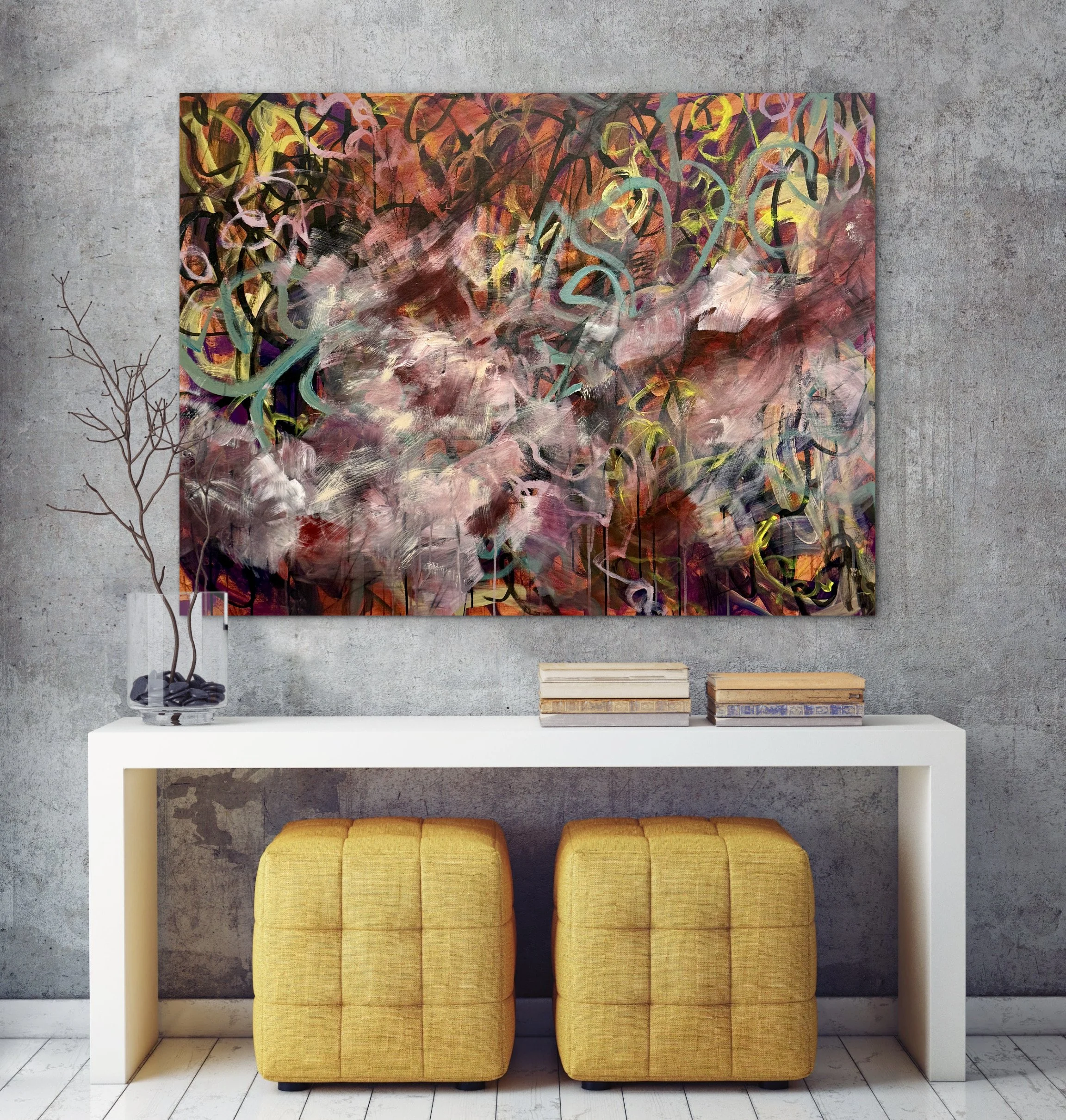 A modern, minimalist interior with a concrete wall, a colorful abstract painting, a white console table, two yellow upholstered ottomans, and a small wooden pallet on the floor.